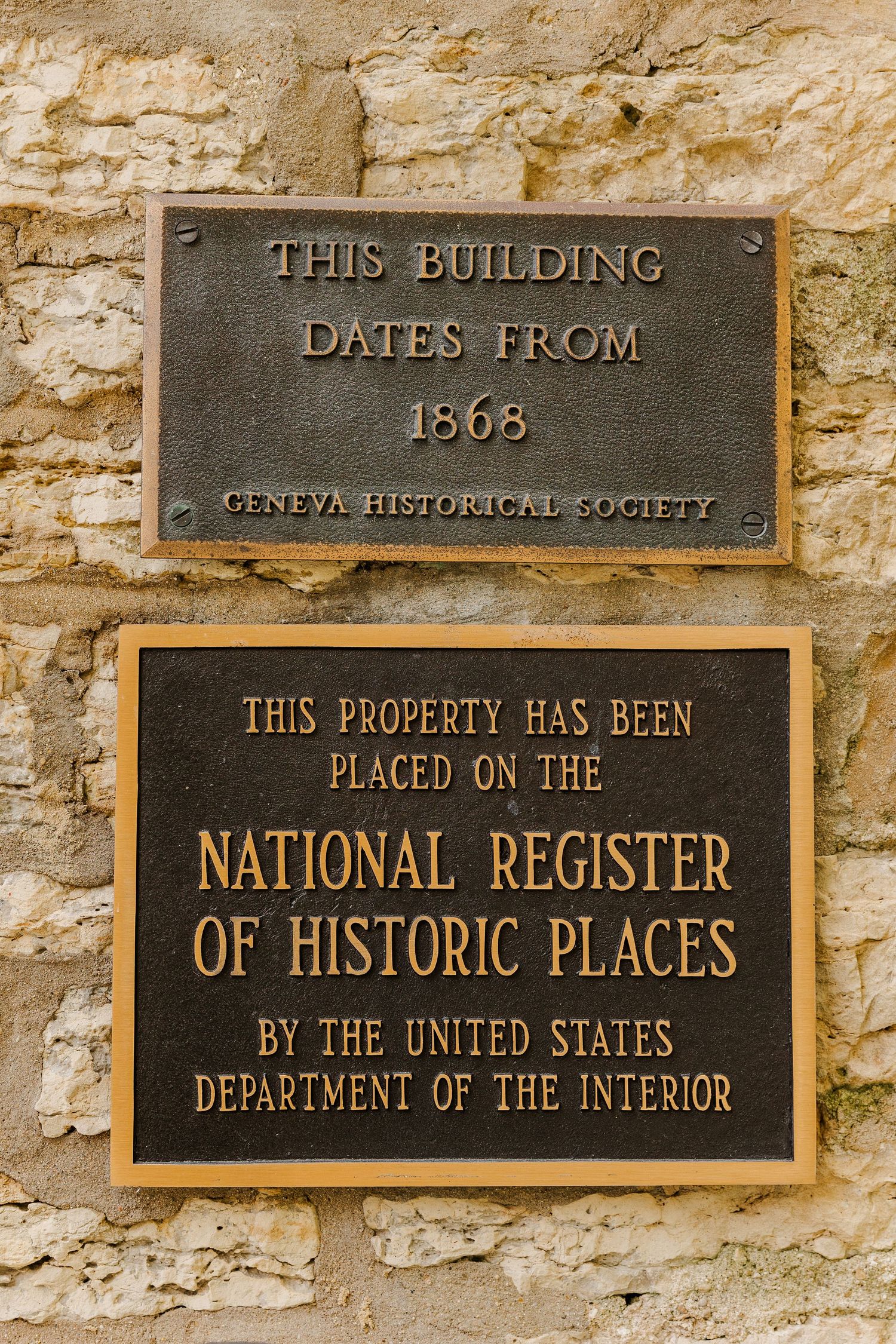 Historic plaques showing building dates from 1868 and National Register of Historic Places designation.