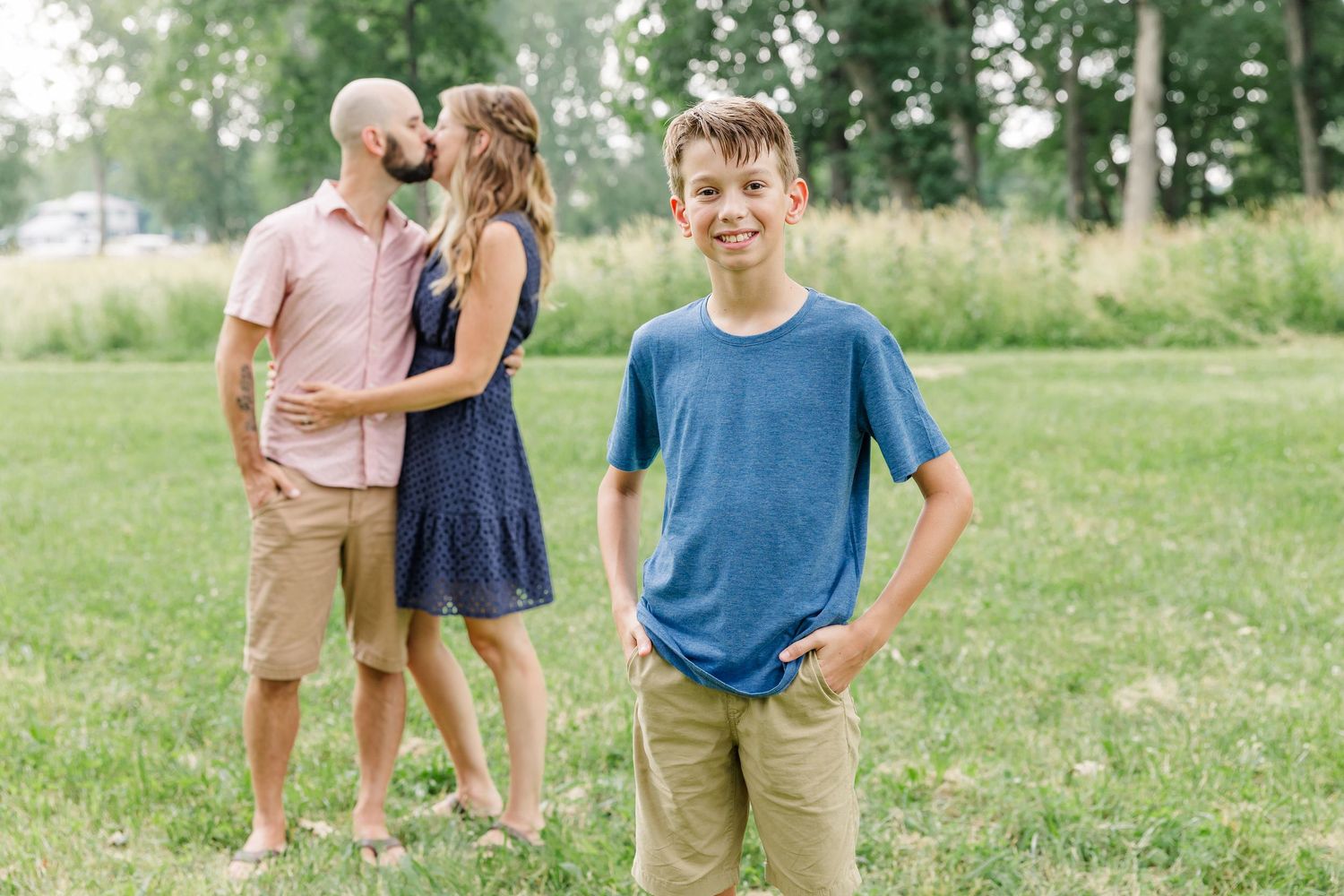 Parents sharing a sweet moment with their children during a summer family session in Crystal Lake, IL.