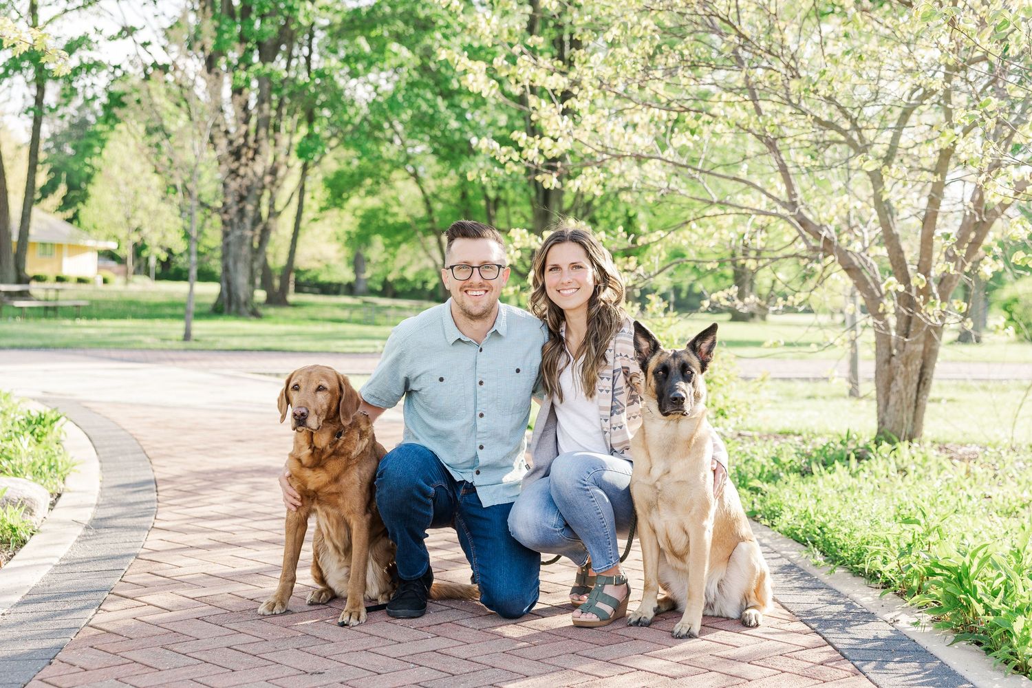 Engagement session with dogs on the brick path at St. James Farm Preserve in Warrenville