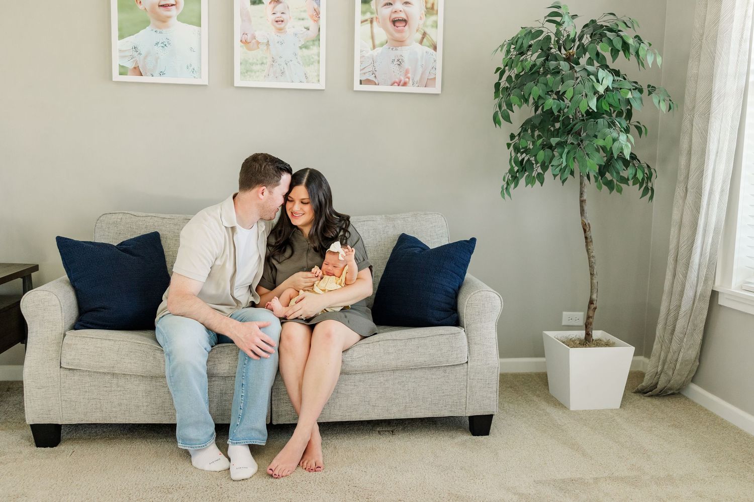 Cozy family photo on the couch during an in-home newborn session in Huntley IL