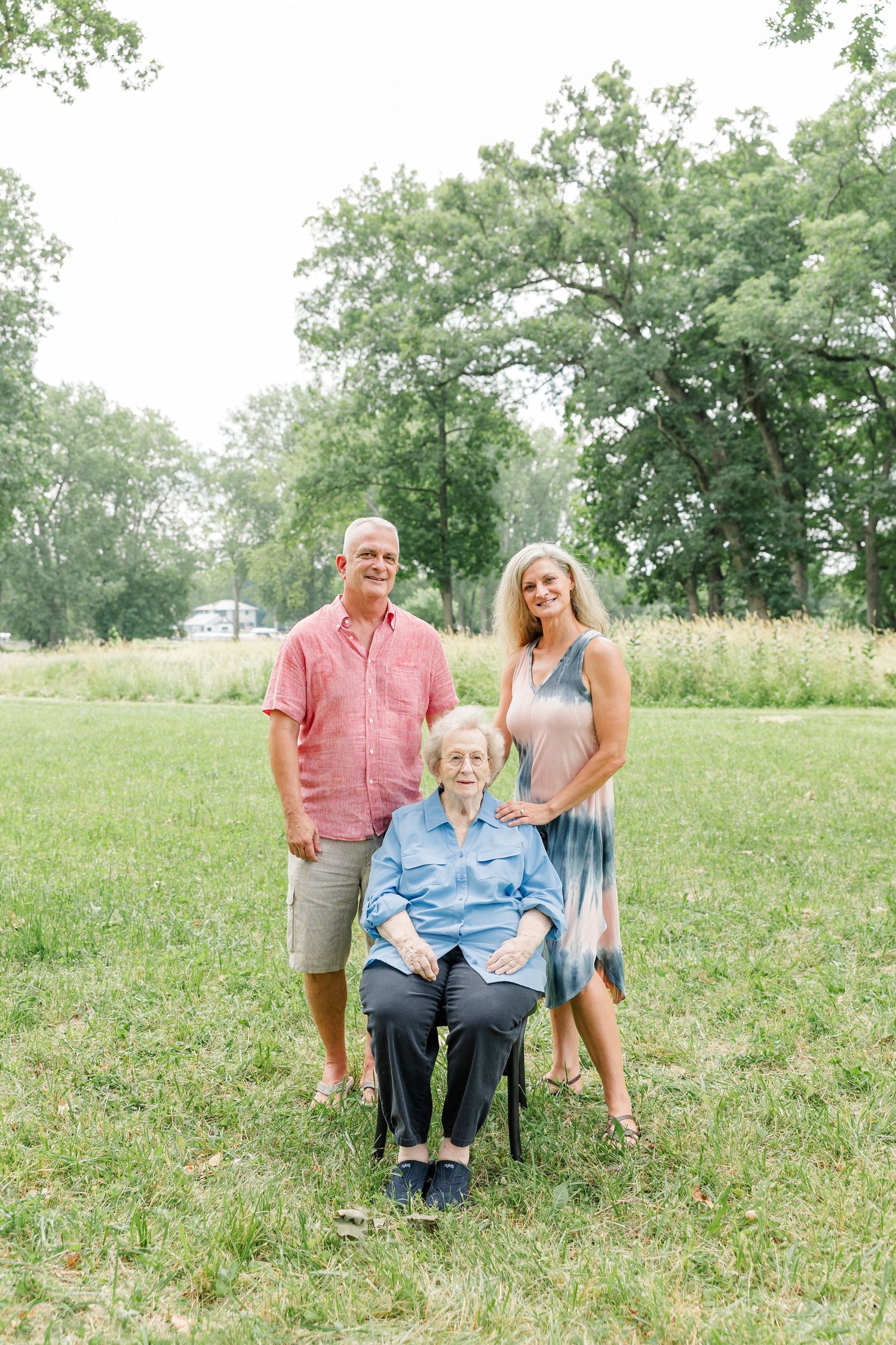 Grandparents and grandchildren posed together in the yard during an extended family session in Crystal Lake, Illinois.