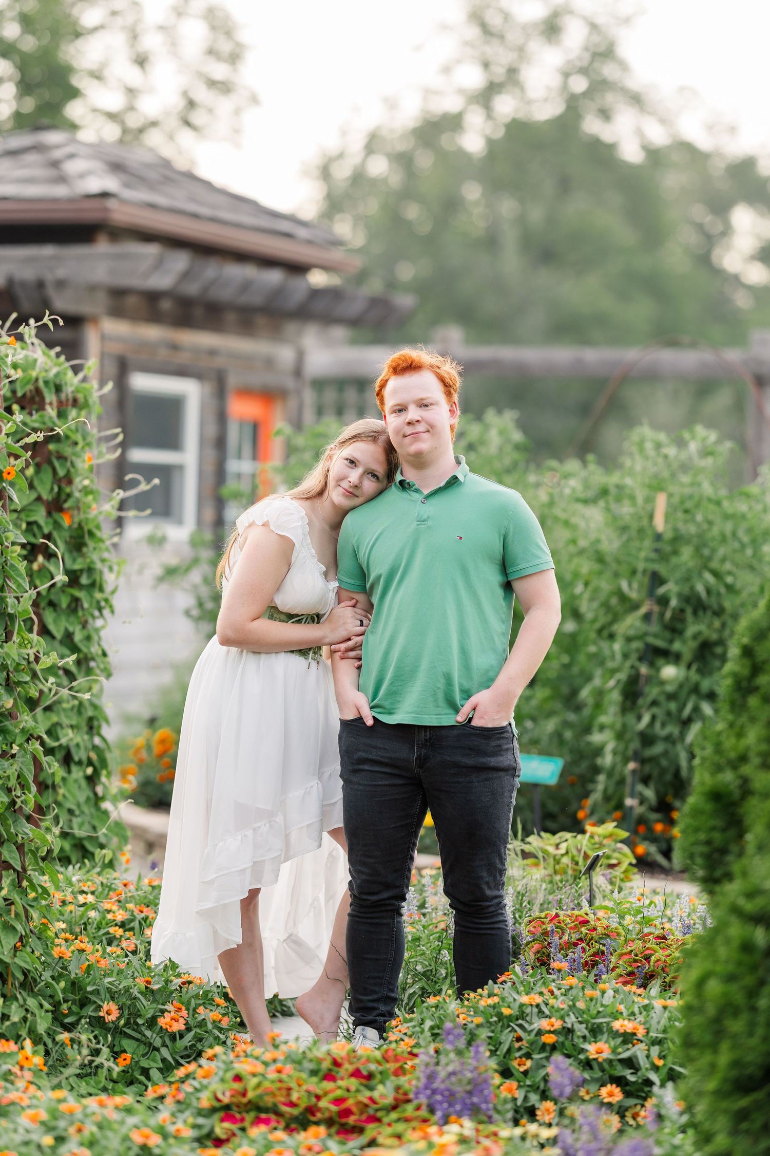 Samantha and her boyfriend Carl pose together among colorful flowers at Cantigny Park in Wheaton.