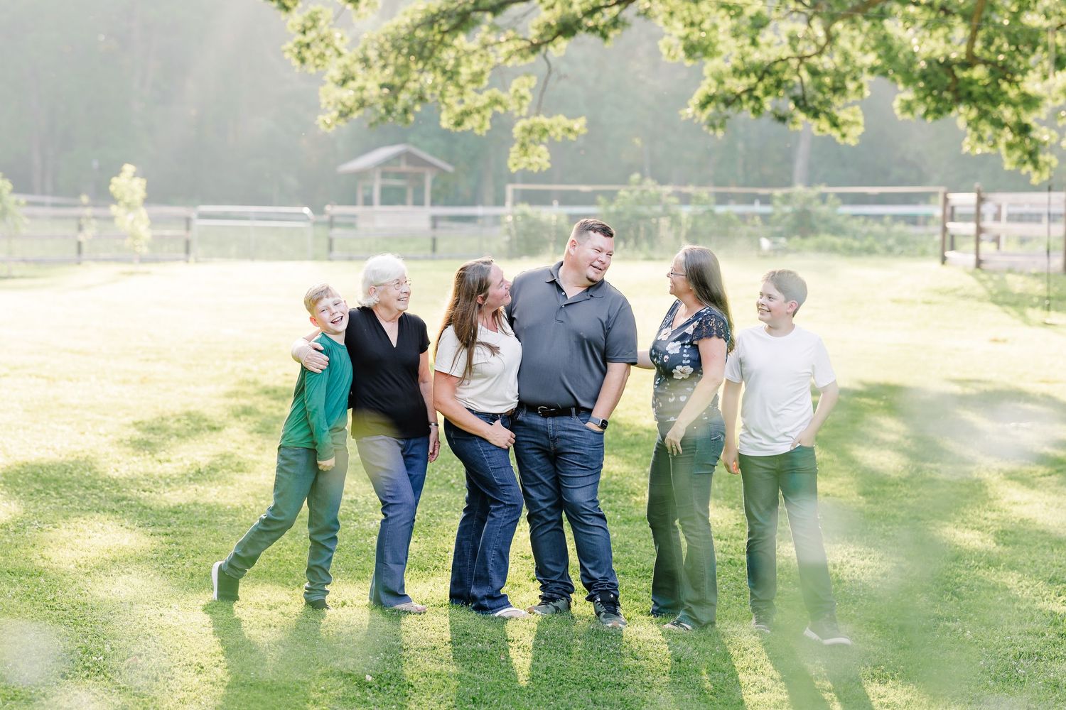 Extended family laughing together during a family portrait in Bull Valley, Illinois.