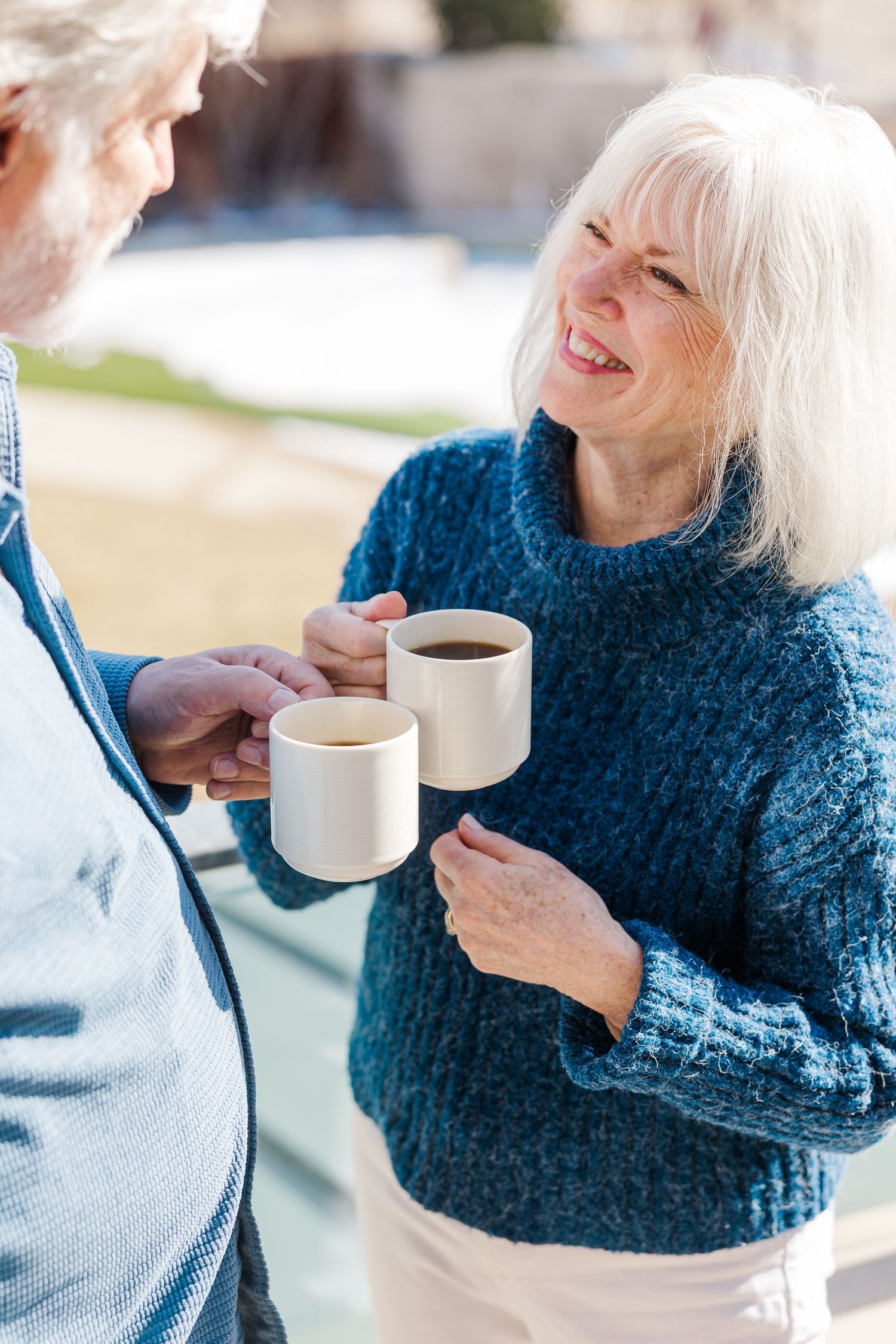 Beacon Hill senior living branding photo in Lombard, Illinois featuring resident holding coffee outside