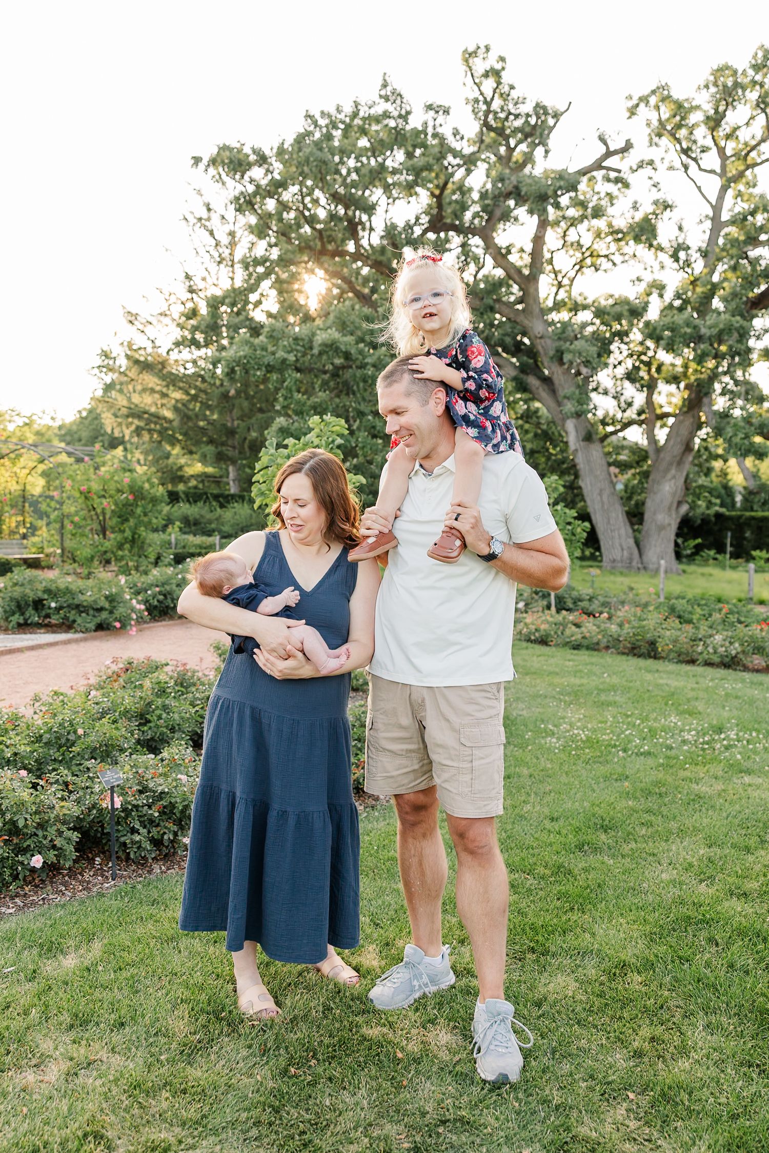 Andrew carrying Caroline on his shoulders while Hilary holds baby Lincoln at Cantigny Park.