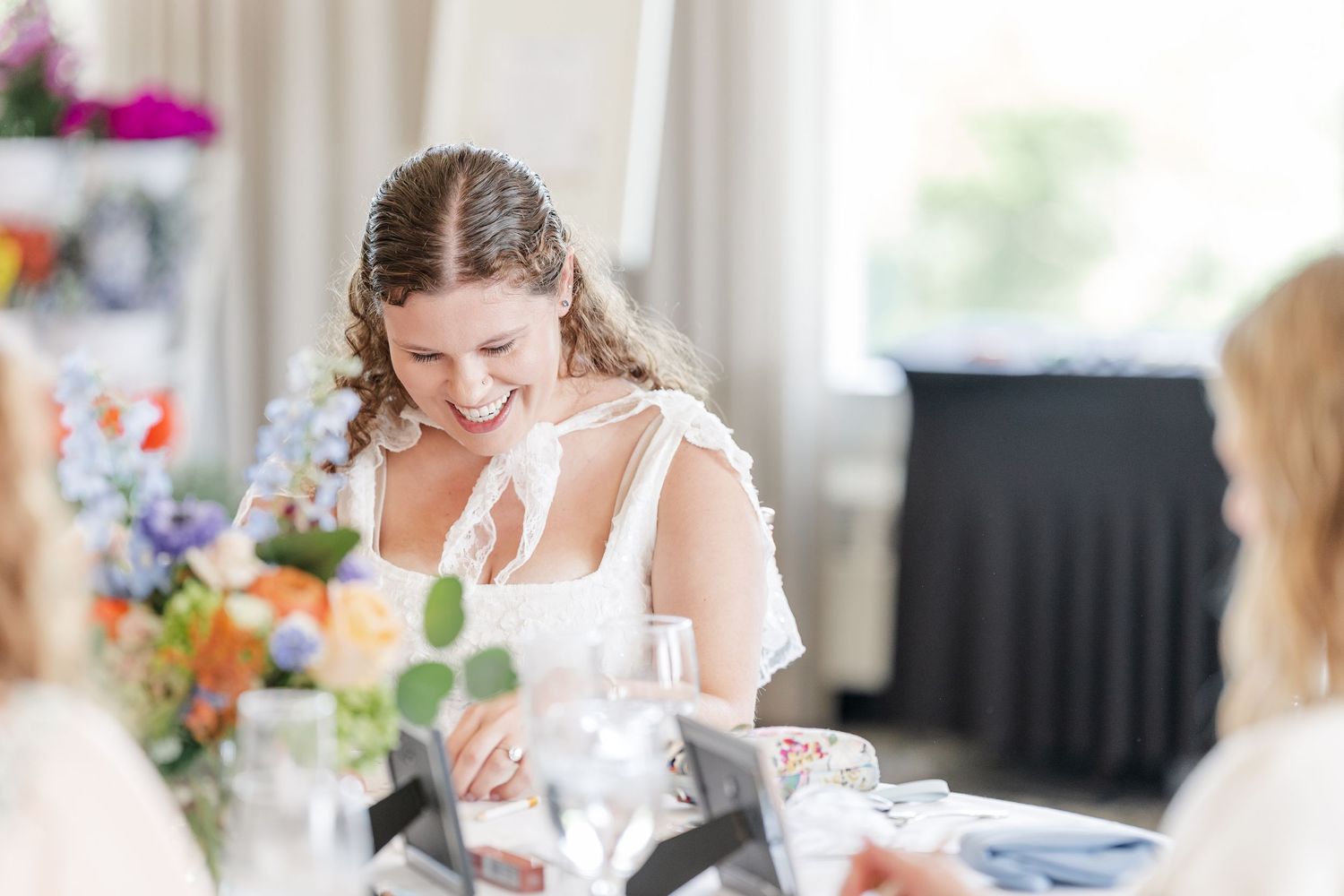 Guest arranging a wildflower bouquet at Sarah's bloom bar bridal shower