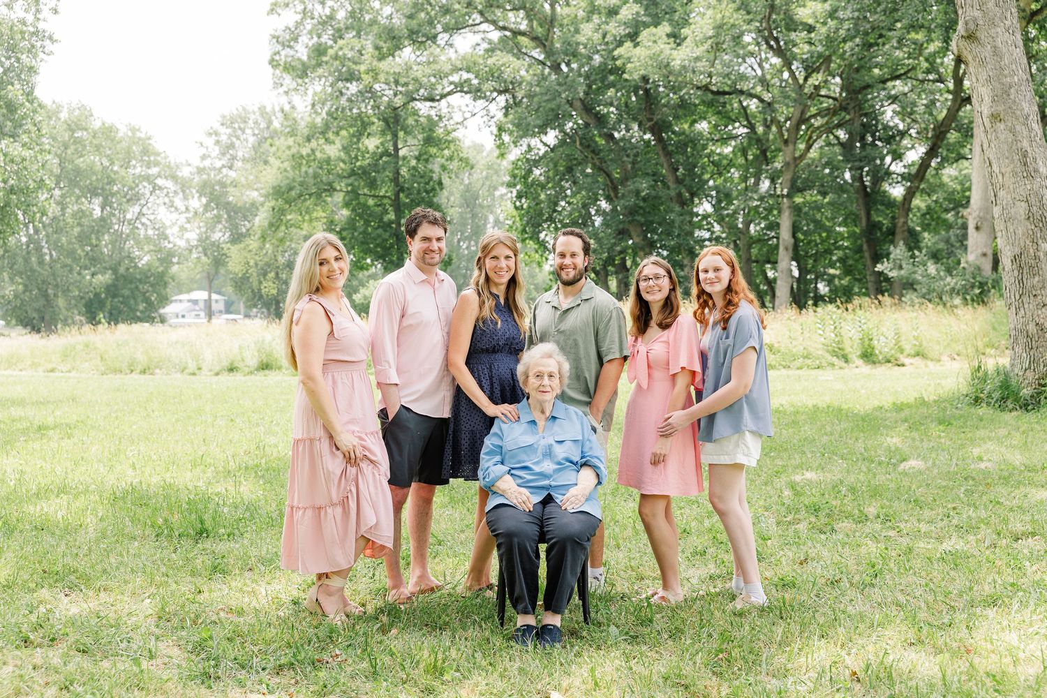 Grandparents posed with their children and grandchildren during a summer extended family session in Crystal Lake, IL.
