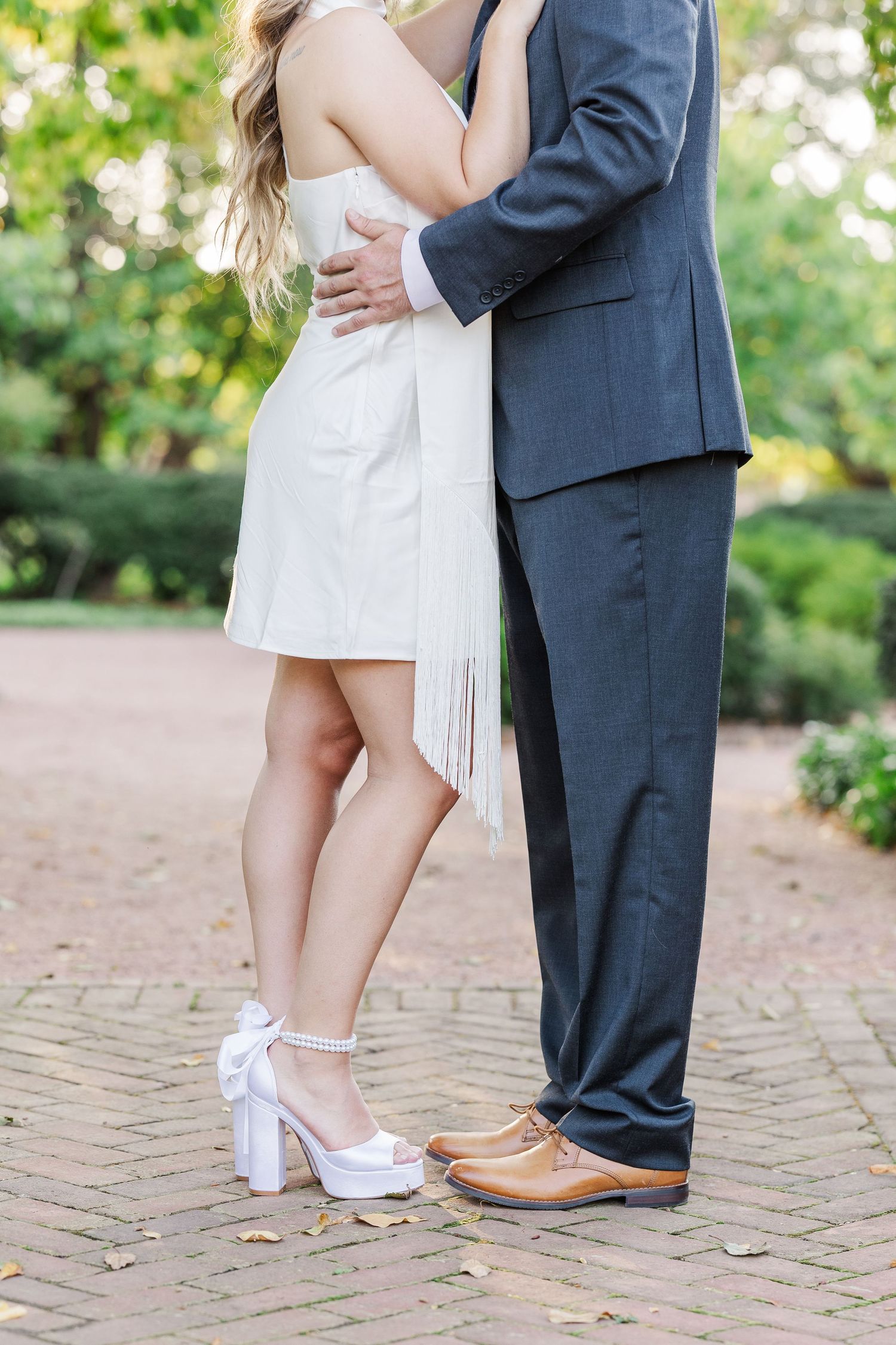 Close-up of couple embracing during engagement photos at Cantigny Park in Wheaton, Illinois