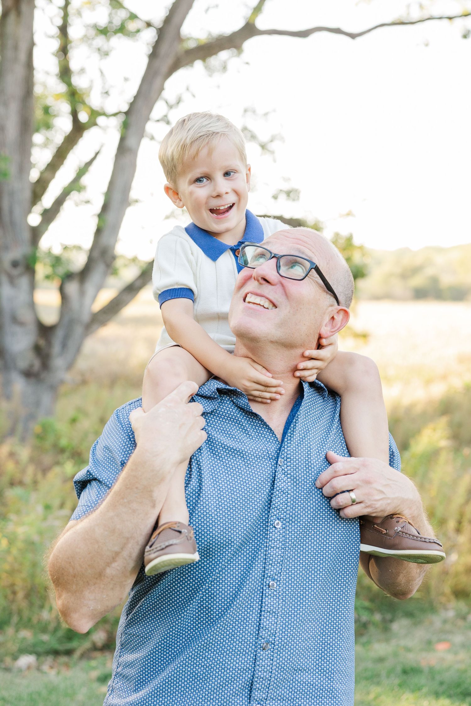 A playful moment captured in a series of outdoor photos showing joyful interaction between parent and child in nature.
