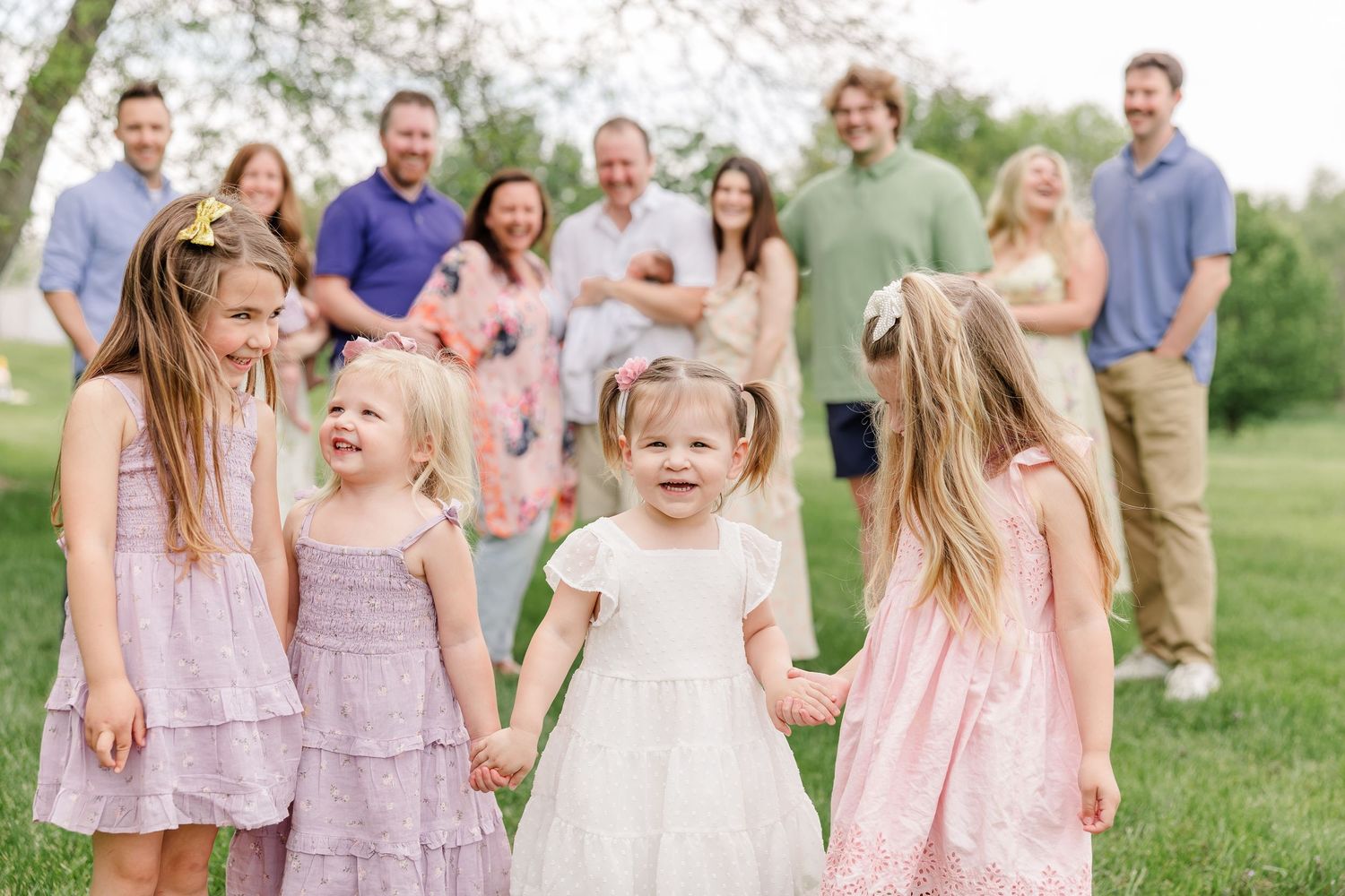 Cousins laughing during extended family photos in Hoffman Estates Illinois