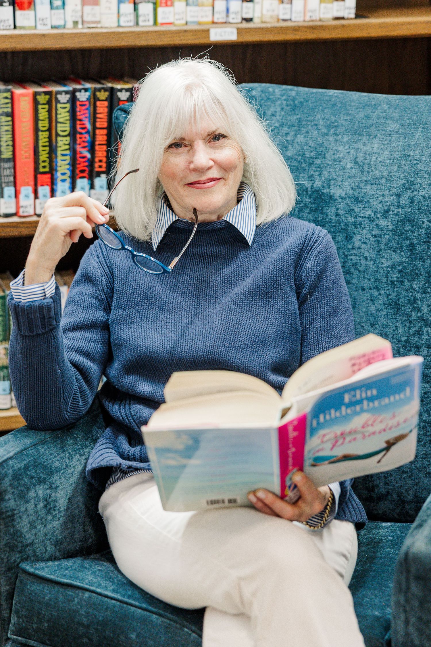 Beacon Hill senior living branding photo in Lombard, Illinois featuring resident reading in library