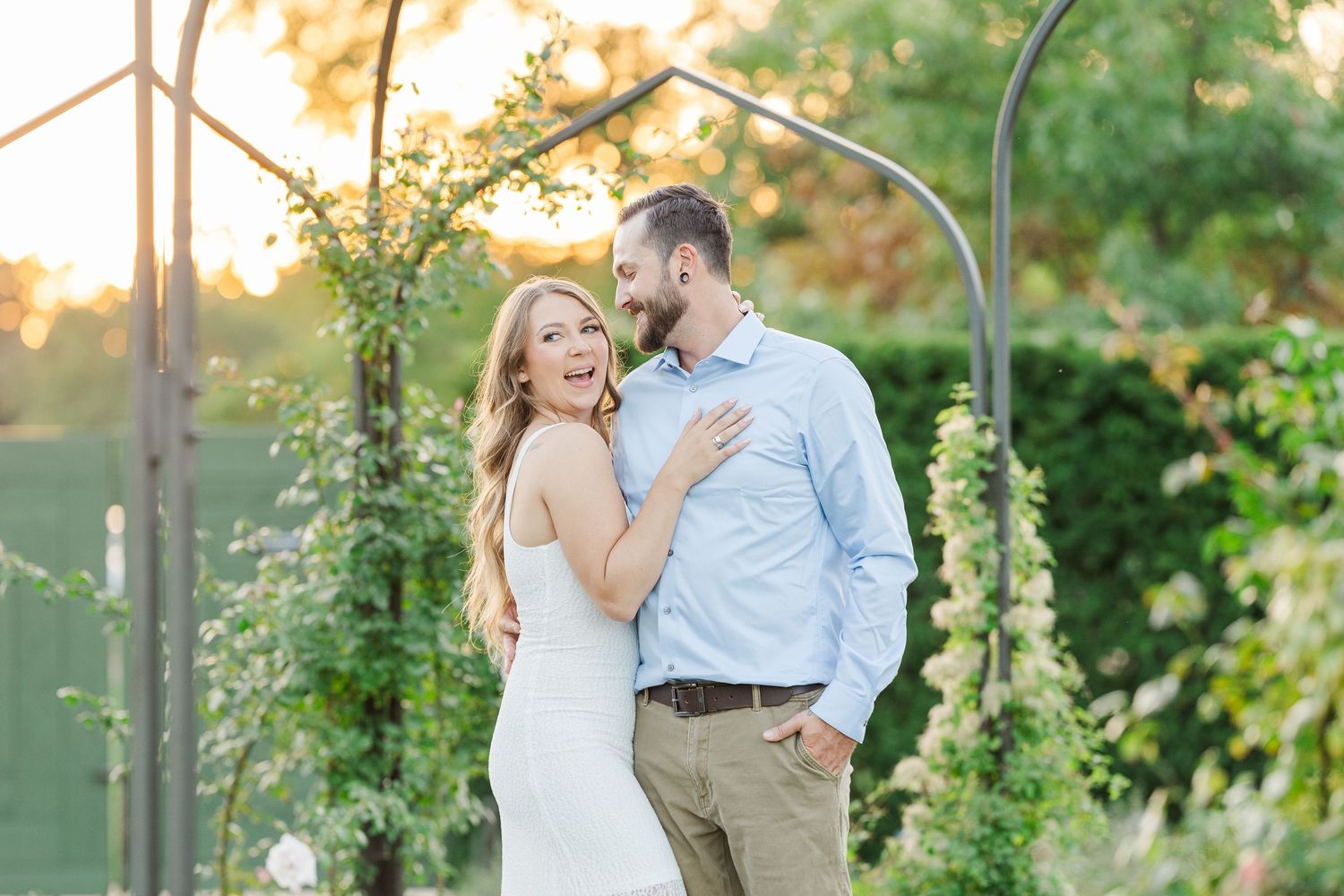 Couple embracing in garden during engagement photos at Cantigny Park in Wheaton, Illinois