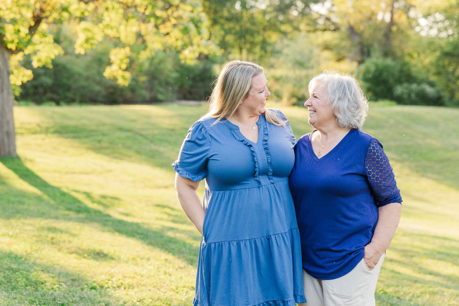 Sorg family portraits at Shamrock Hills Park in Crystal Lake IL during late summer Maureen and her mom smiling at each other.