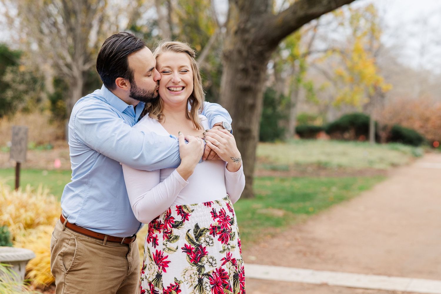 Couple embrace in the keyhole garden at Cantigny Park in Wheaton IL