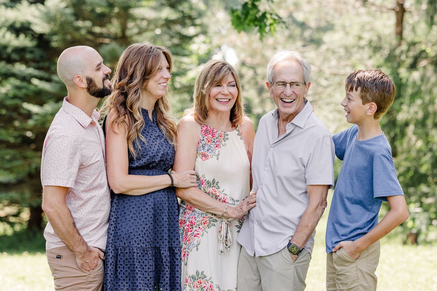 Multi-generation family laughing together during an extended family session in Crystal Lake, IL.