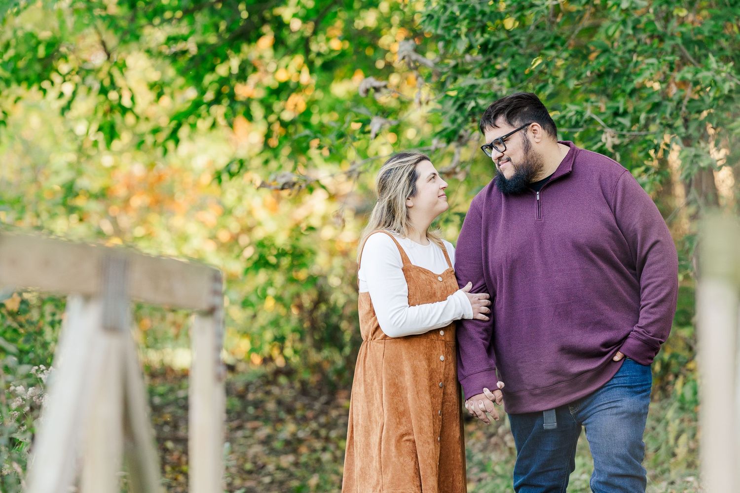 A couple shares tender moments together during an autumn outdoor photo session in a park setting. Shamrock Hills Crystal Lake