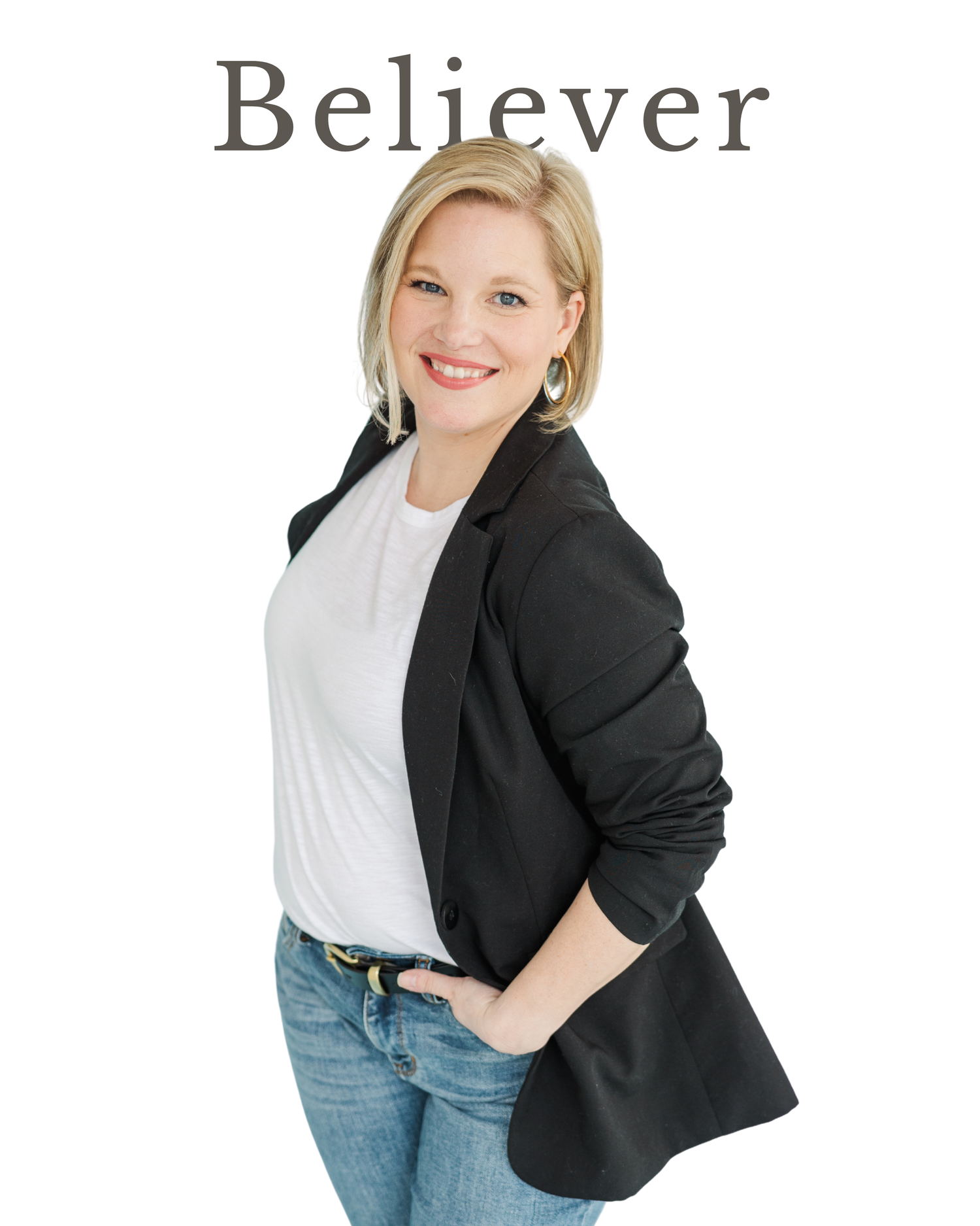 Cassie Lacina smiling in a black blazer during studio branding portraits