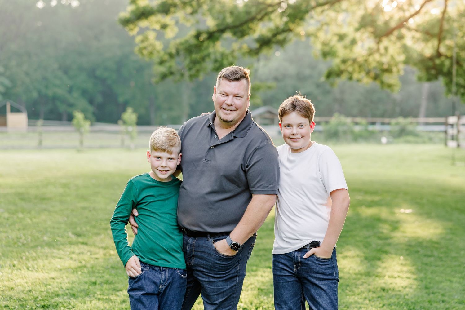 Father with his two sons during an outdoor family portrait in Bull Valley, Illinois.