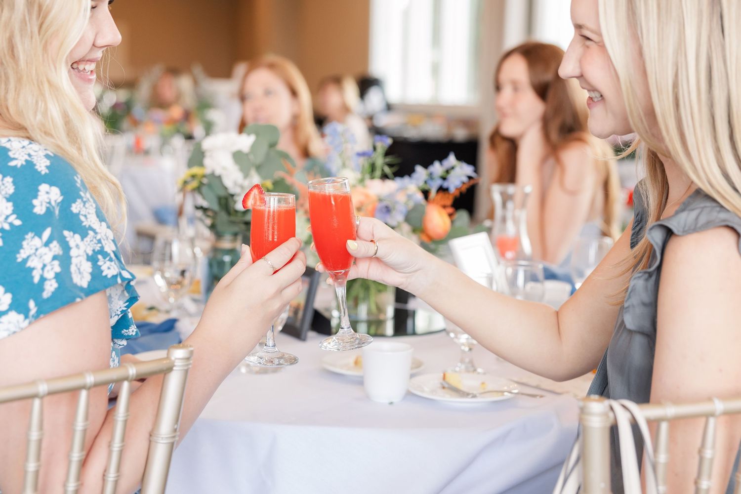 Bridal shower guests toasting with mimosas at Itasca Country Club