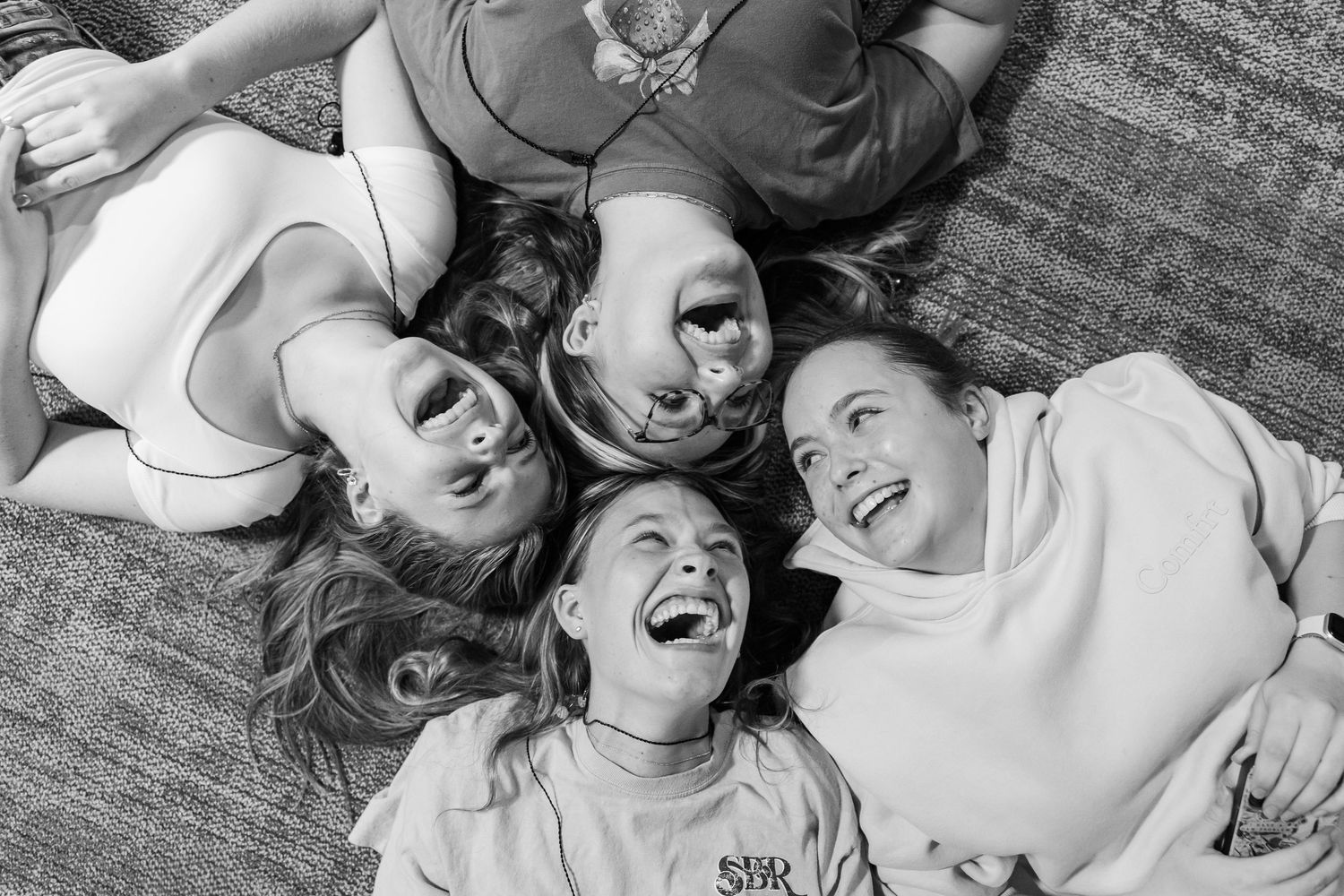 Group of women laughing together during a church gathering at The Chapel in McHenry