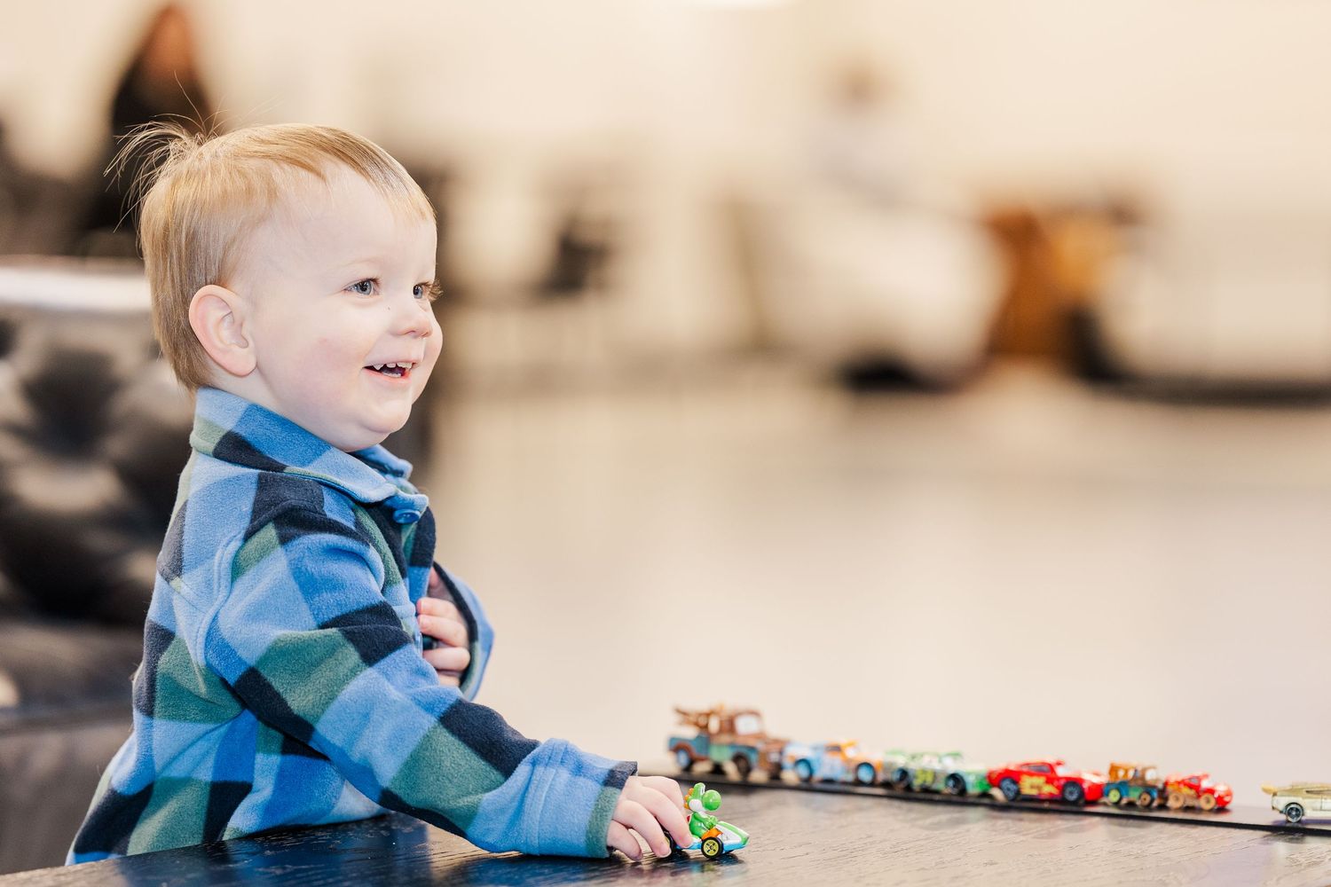 Toddler playing with toy cars during a church event at The Chapel in McHenry