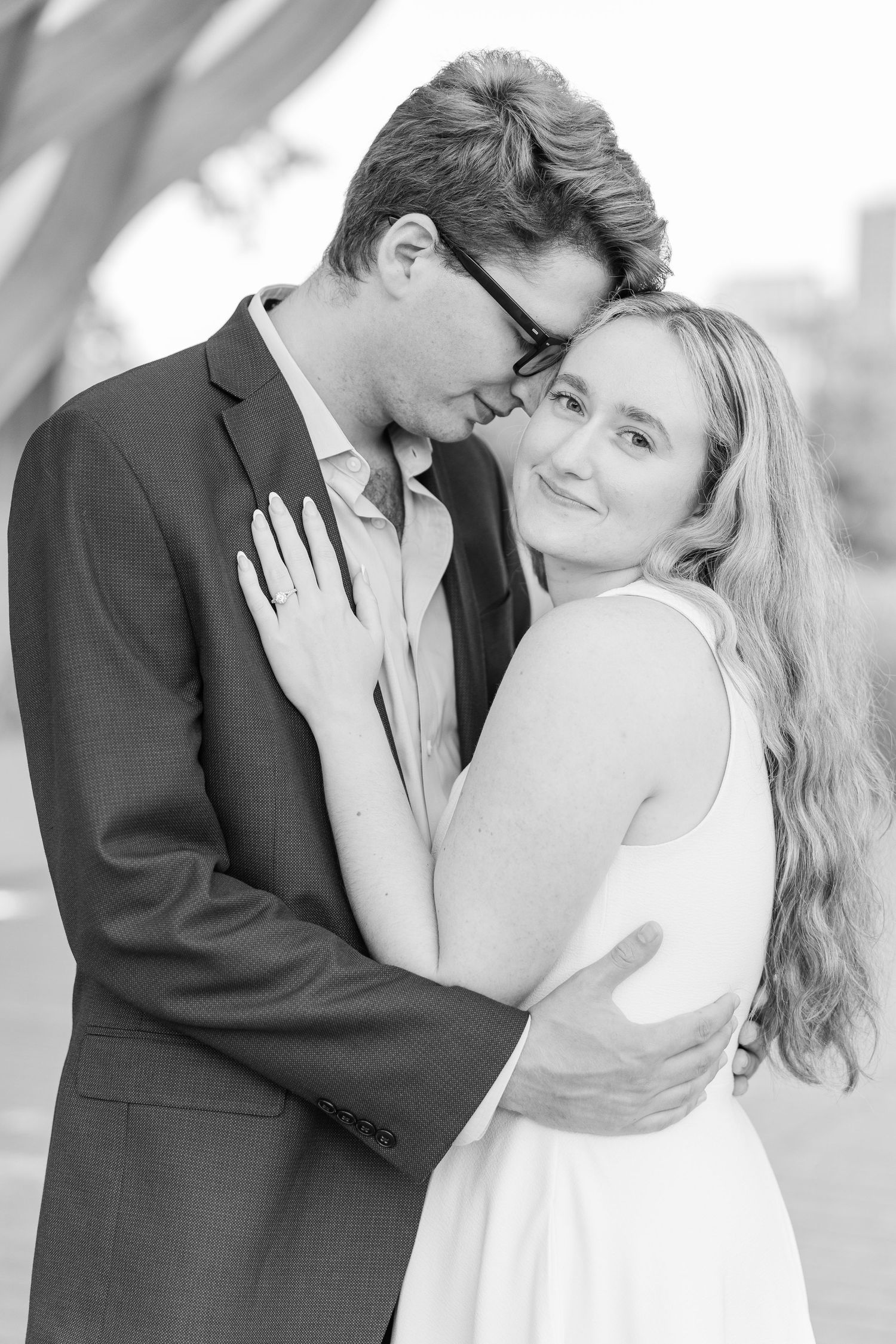 Close-up of Elizabeth and Joe laughing together, with the soft evening light highlighting their smiles.