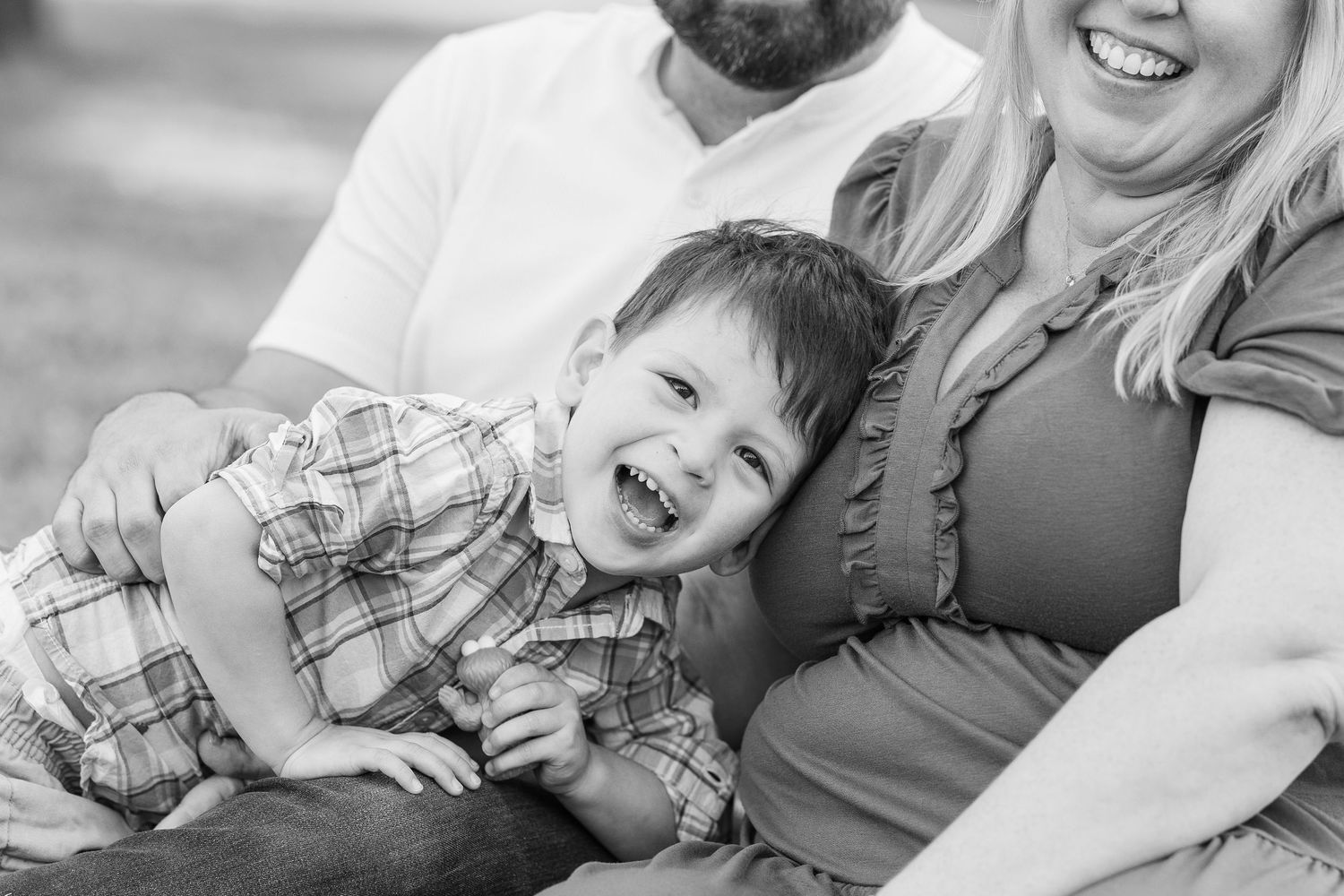 Black and white collage of candid family moments showing playful interactions and joyful expressions.Sorg family portraits at Shamrock Hills