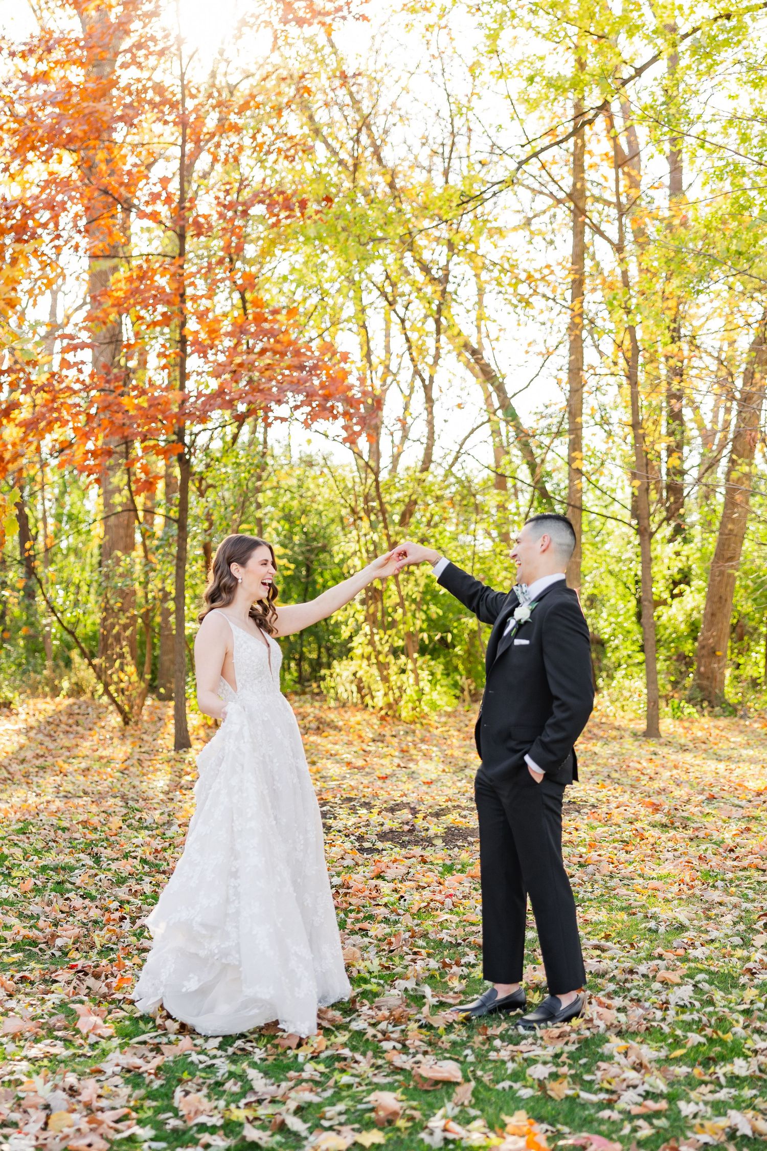 Bride twirling during fall wedding portraits at Hyatt Lodge in Oak Brook Illinois photographed by Rachael Watson Photography