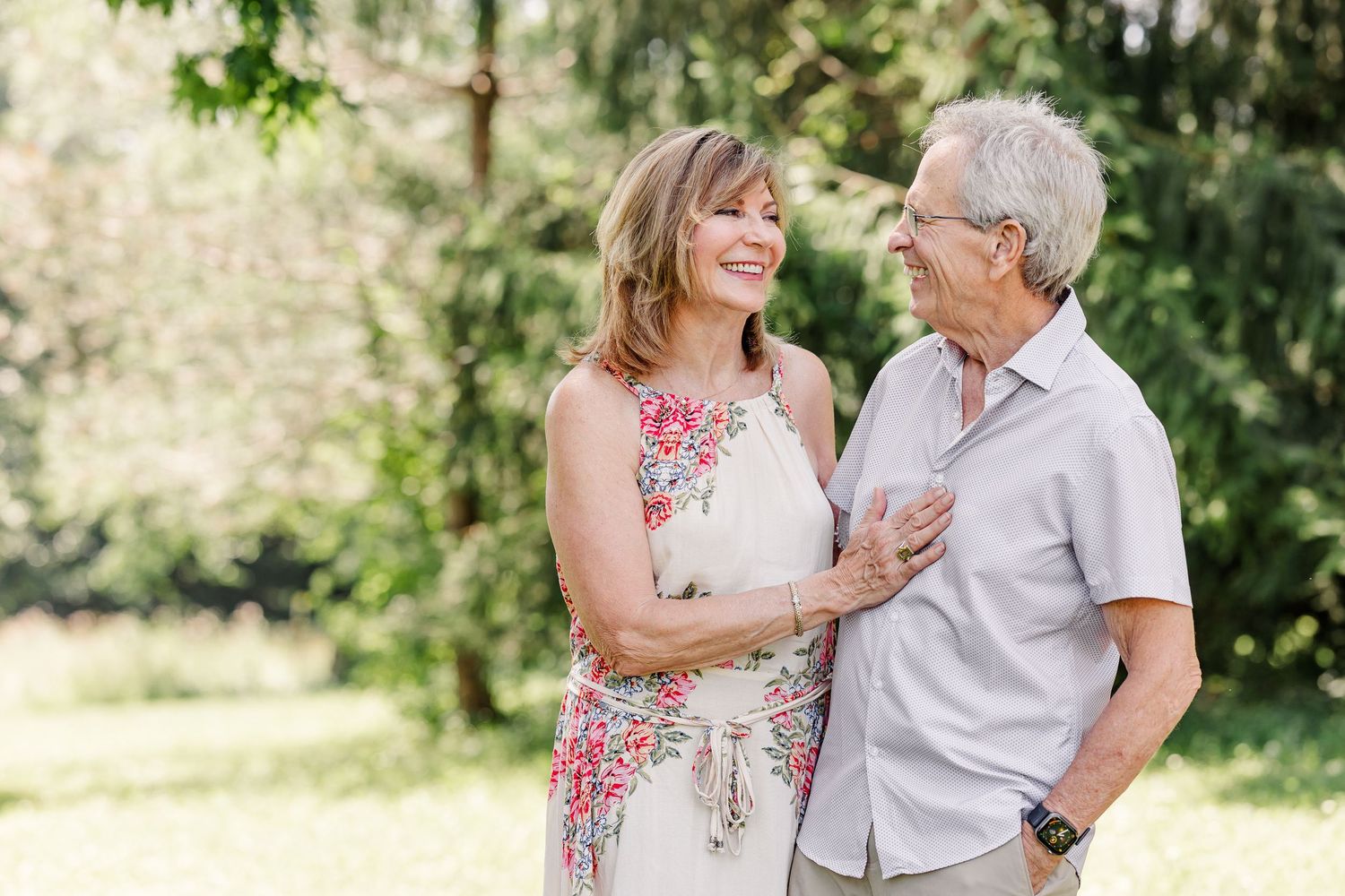 Couple smiling together during a summer extended family photo session in Crystal Lake, Illinois.