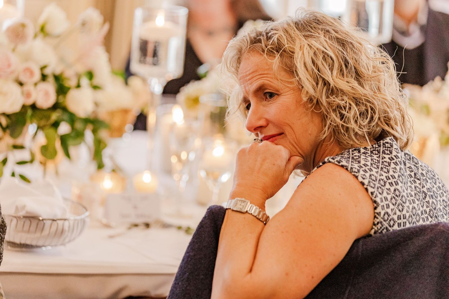 Guest enjoying an elegant wedding reception dinner in a well-lit banquet room.