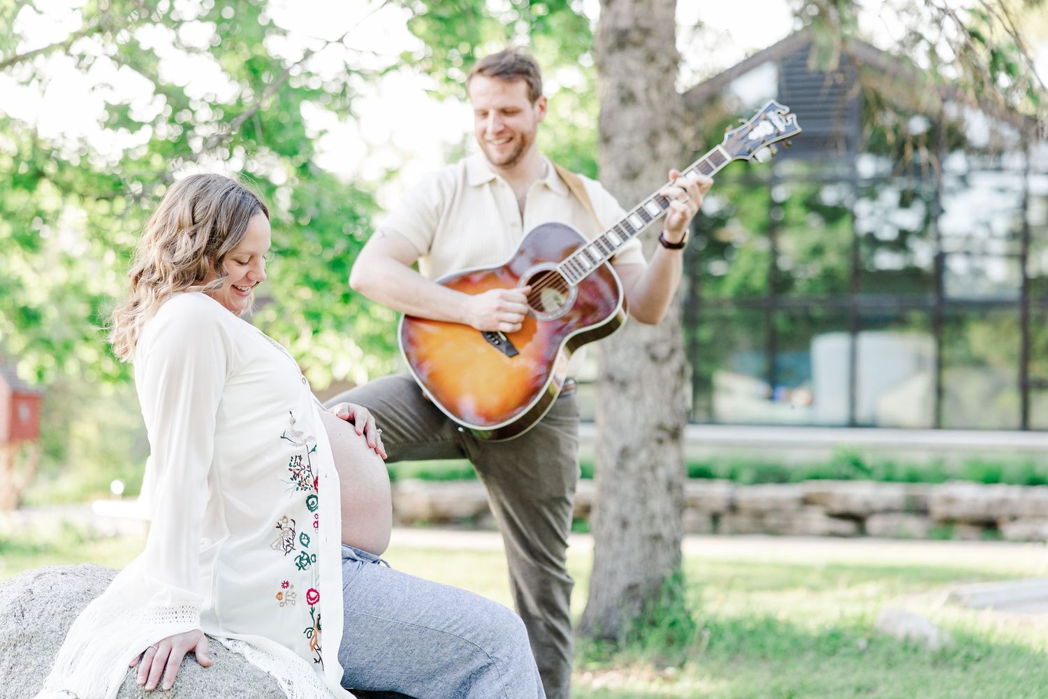 Expecting parents with guitar during a music-inspired maternity session at Veterans Acres Nature Center in Crystal Lake, IL
