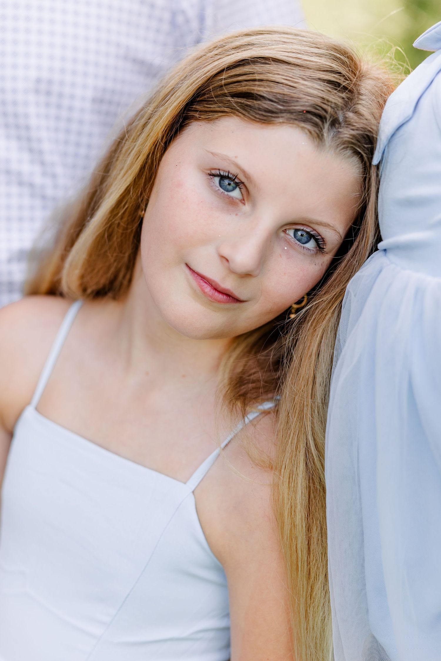 Portrait of a young girl during a bright summer family photo session in Crystal Lake, IL.