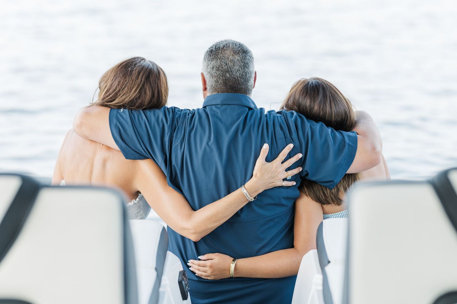 Family portrait from behind on dock during Pistakee Lake family photos at Pistakee Lake