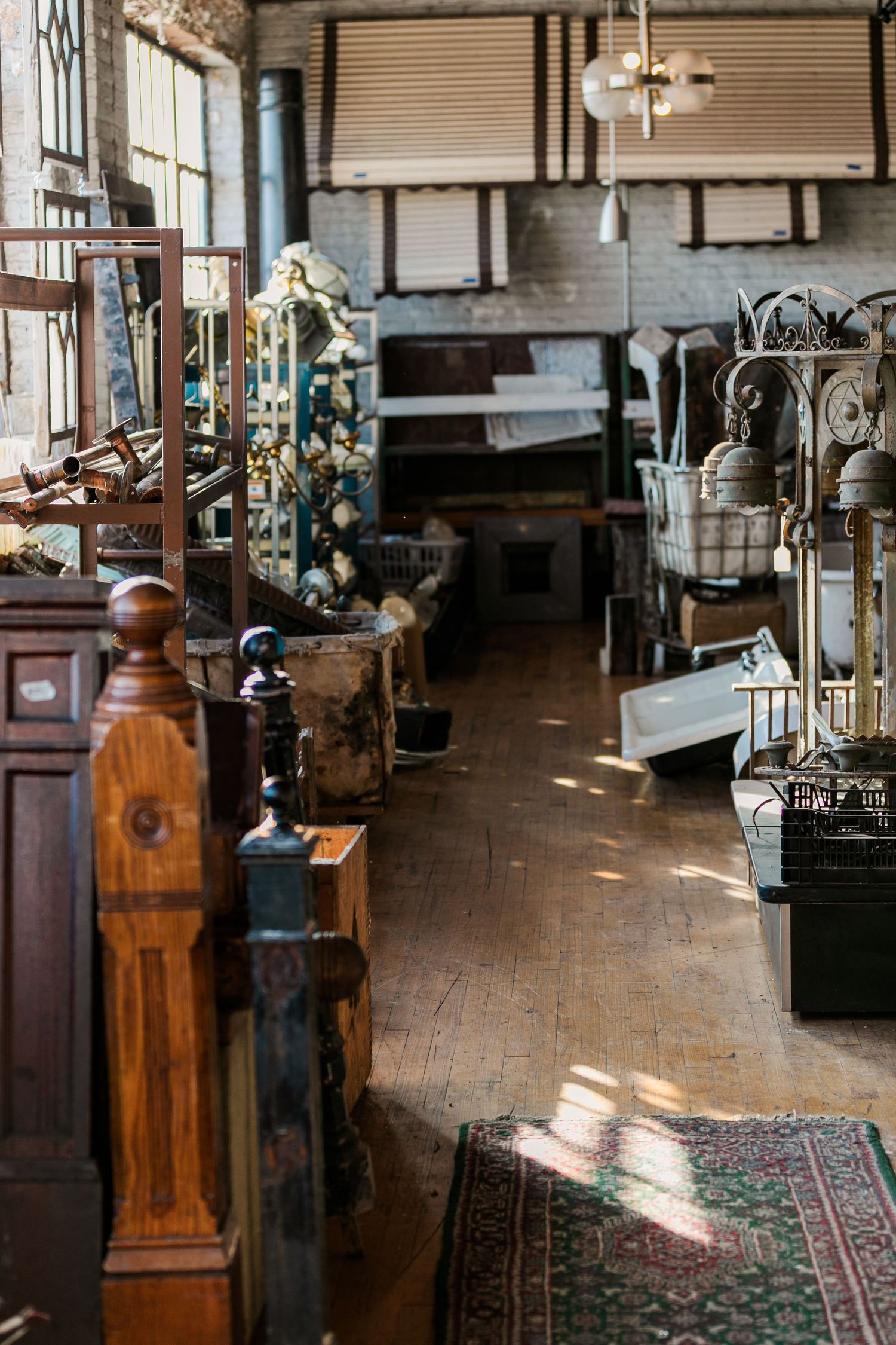 An antique-filled interior space with wooden fixtures and vintage decorative elements.