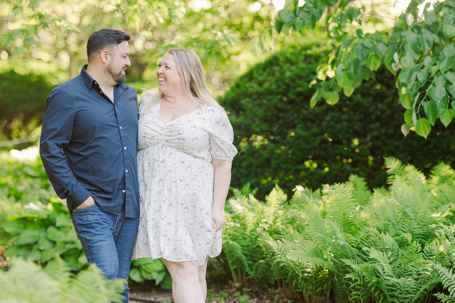 A romantic spring photoshoot in a lush garden setting with soft natural lighting.