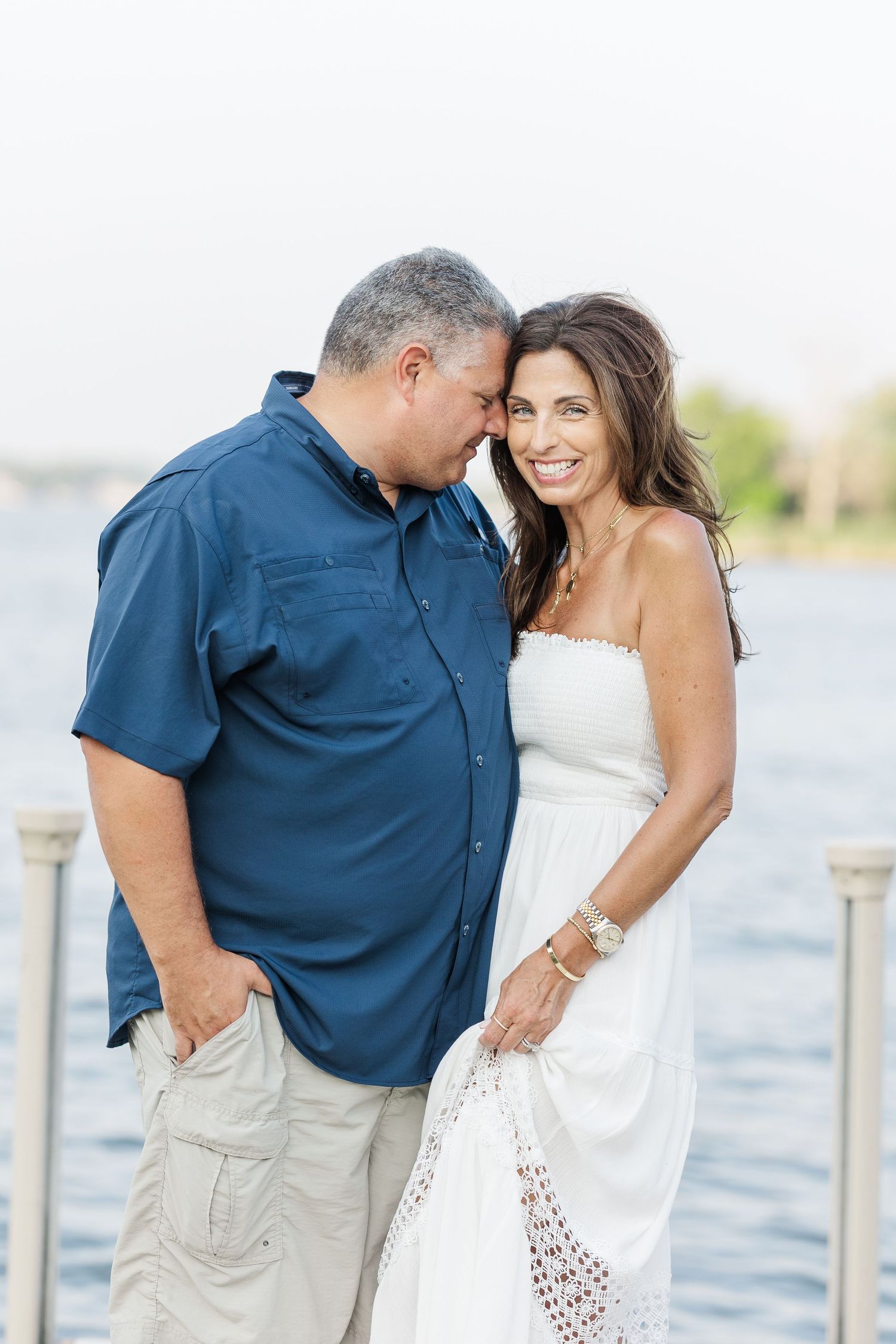 Couple portrait on dock during Pistakee Lake family photos in Johnsburg, Illinois