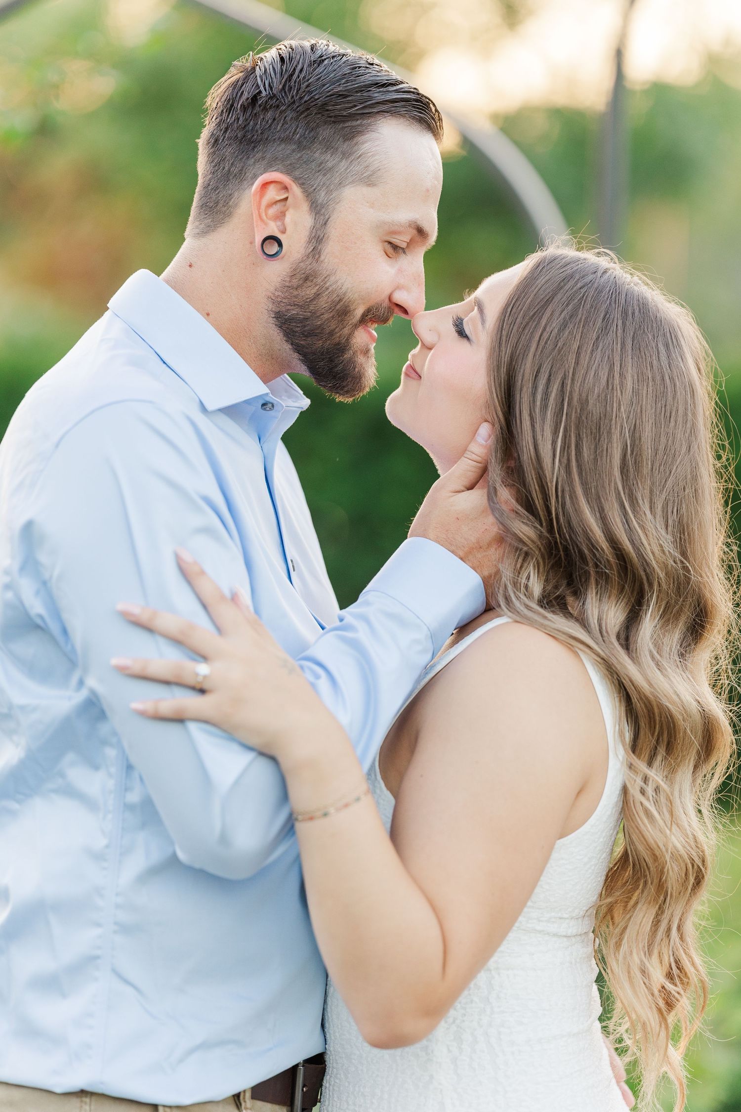 Couple embracing during engagement photos at Cantigny Park in Wheaton, Illinois