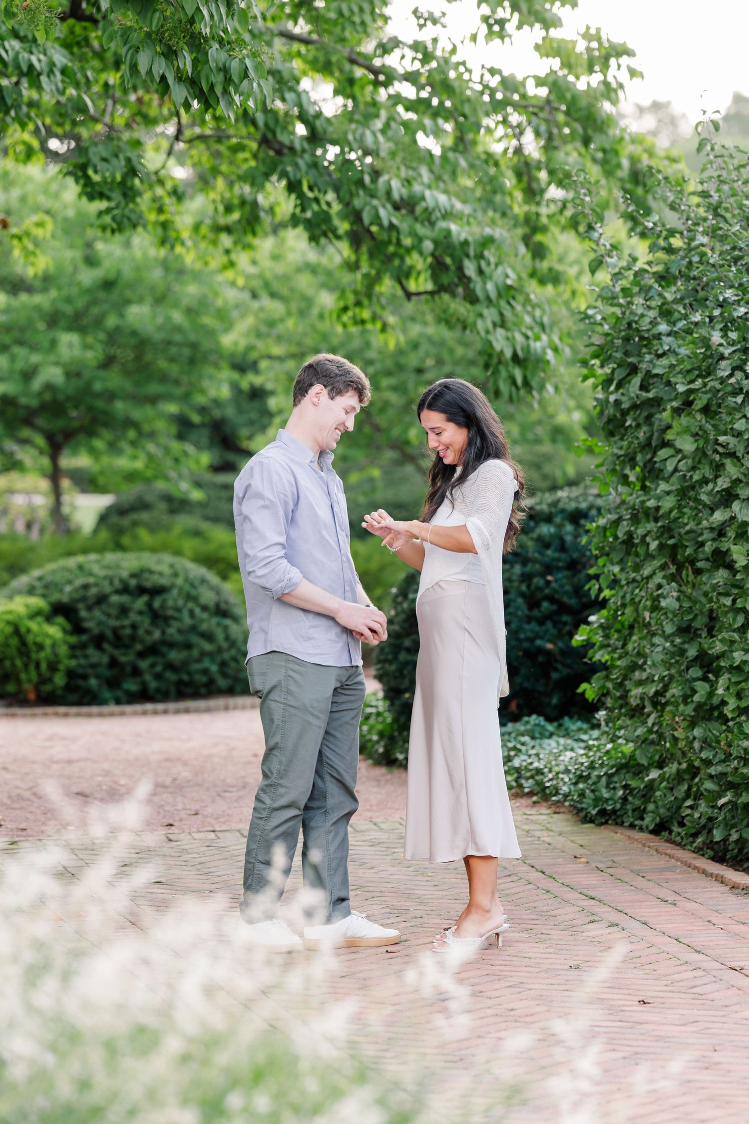 Jack and Alysia look at her engagement ring following his surprise proposal.