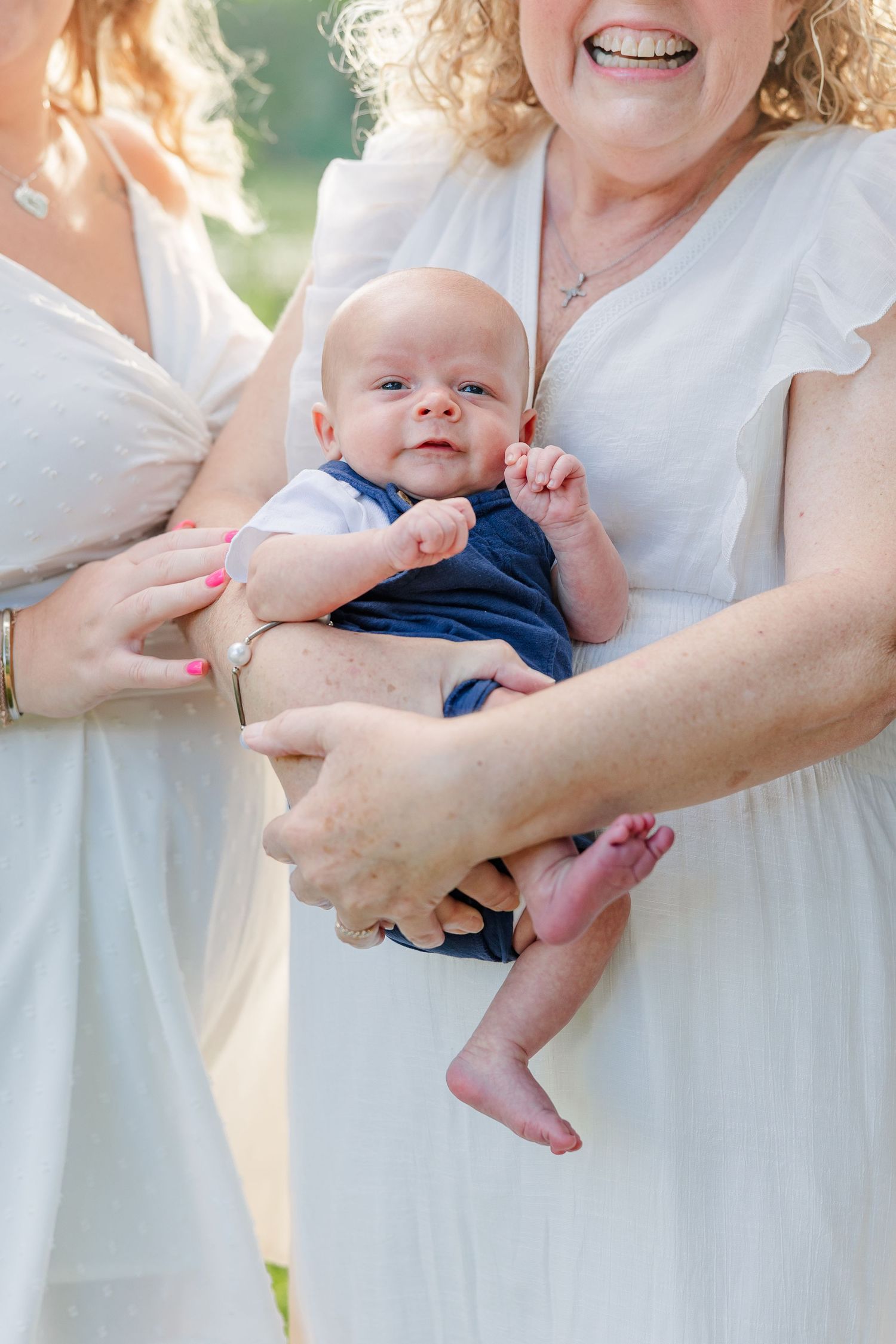 Close-up of a baby boy being held during an extended family photo session at Veterans Acres Nature Center in Crystal Lake
