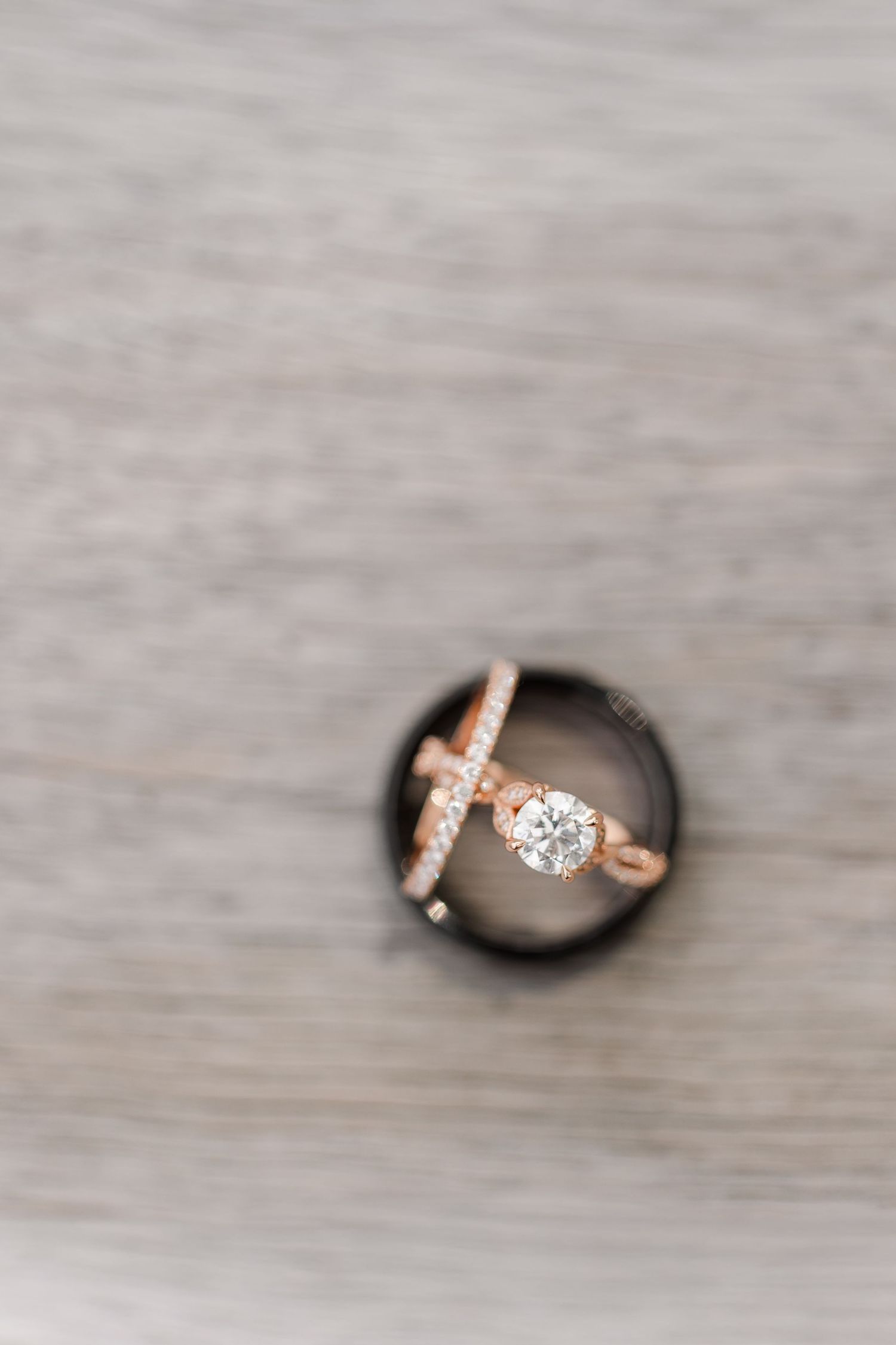 Close-up of the newlyweds’ wedding rings arranged on a black ring box during their Cantigny Park portrait session.