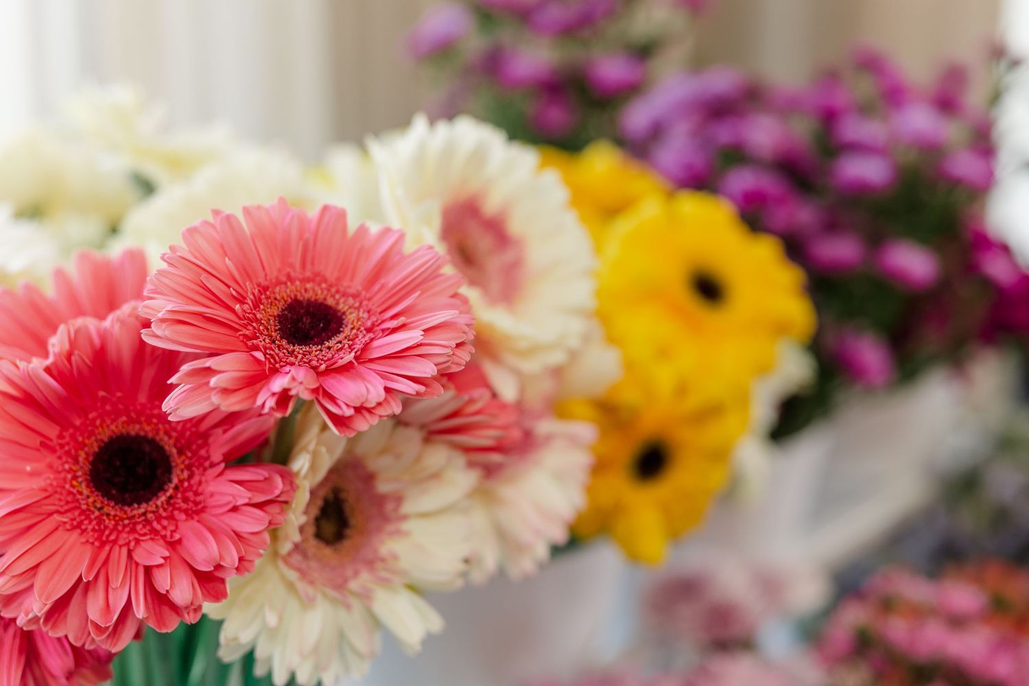 Colorful gerbera daisy and wildflower bouquet at Itasca bridal shower