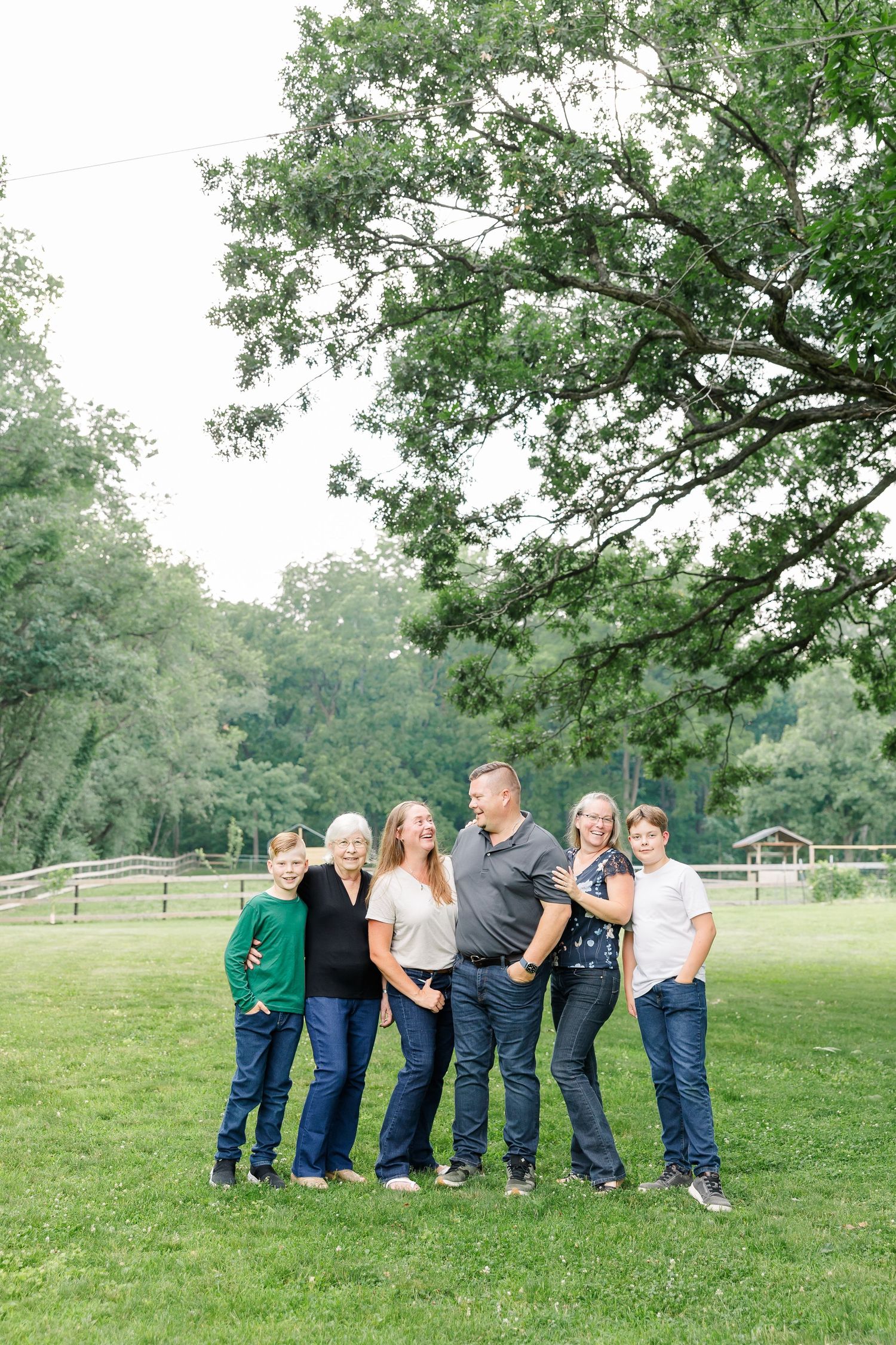 Family portrait beneath a large oak tree in Bull Valley, Illinois.