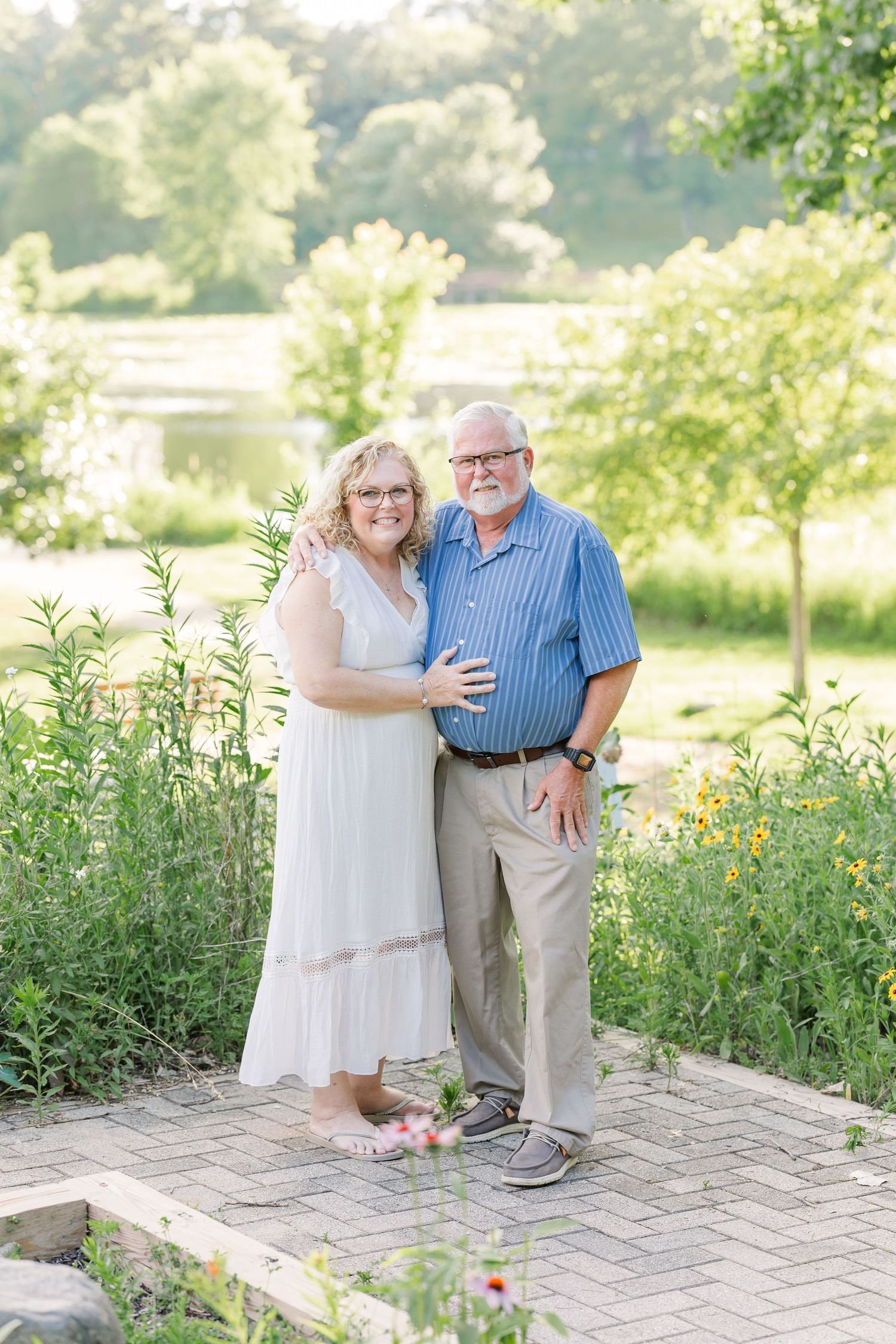 Grandparents smiling together during an extended family session at Veterans Acres Nature Center in Crystal Lake, Illinois