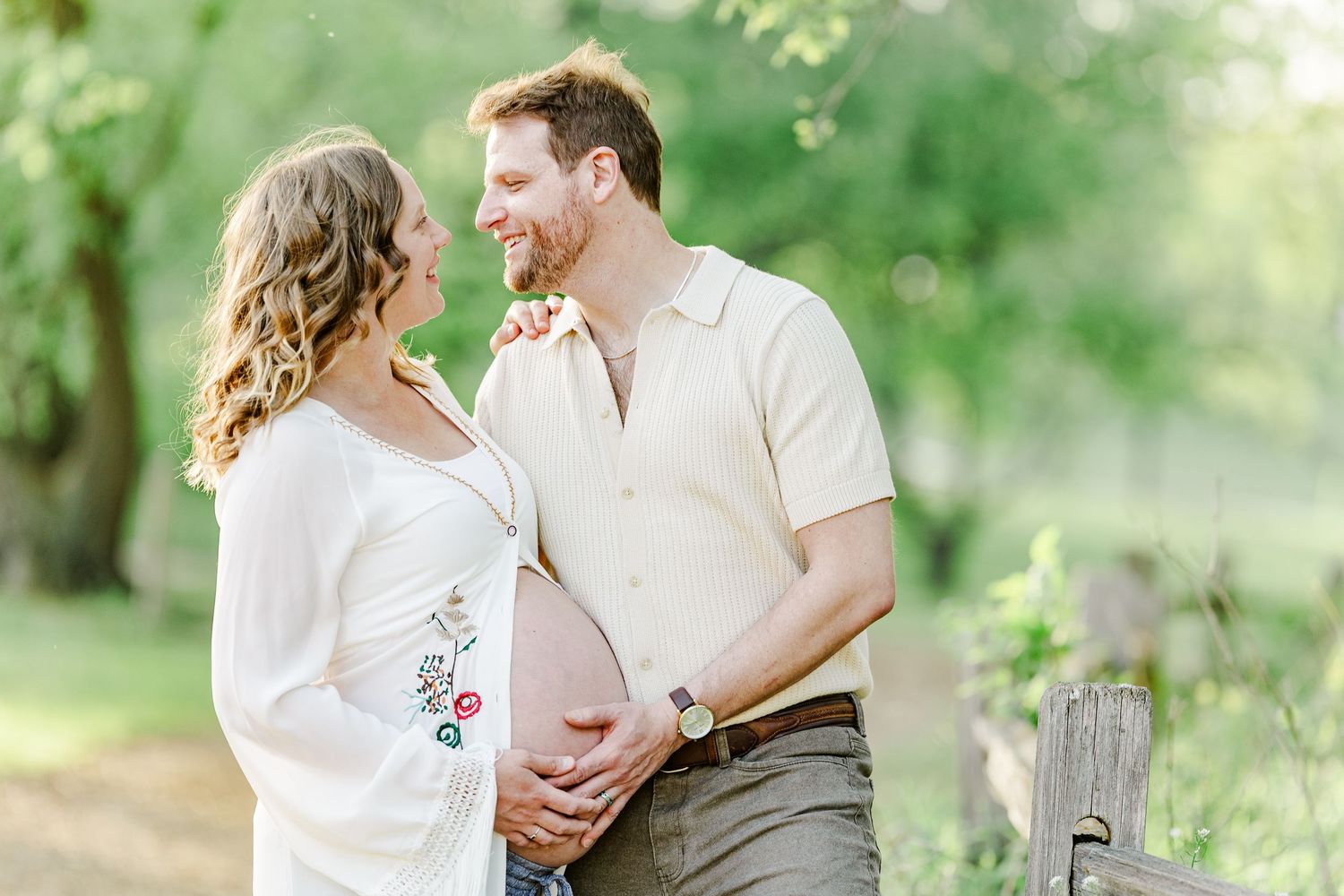 Golden hour maternity portrait of expecting parents at Veterans Acres Nature Preserve in Crystal Lake.