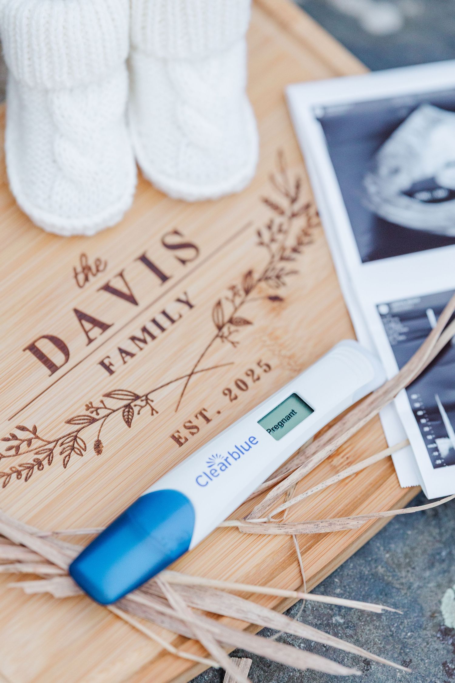 Pregnancy announcement details with engraved board and ultrasound photo in Cary, Illinois