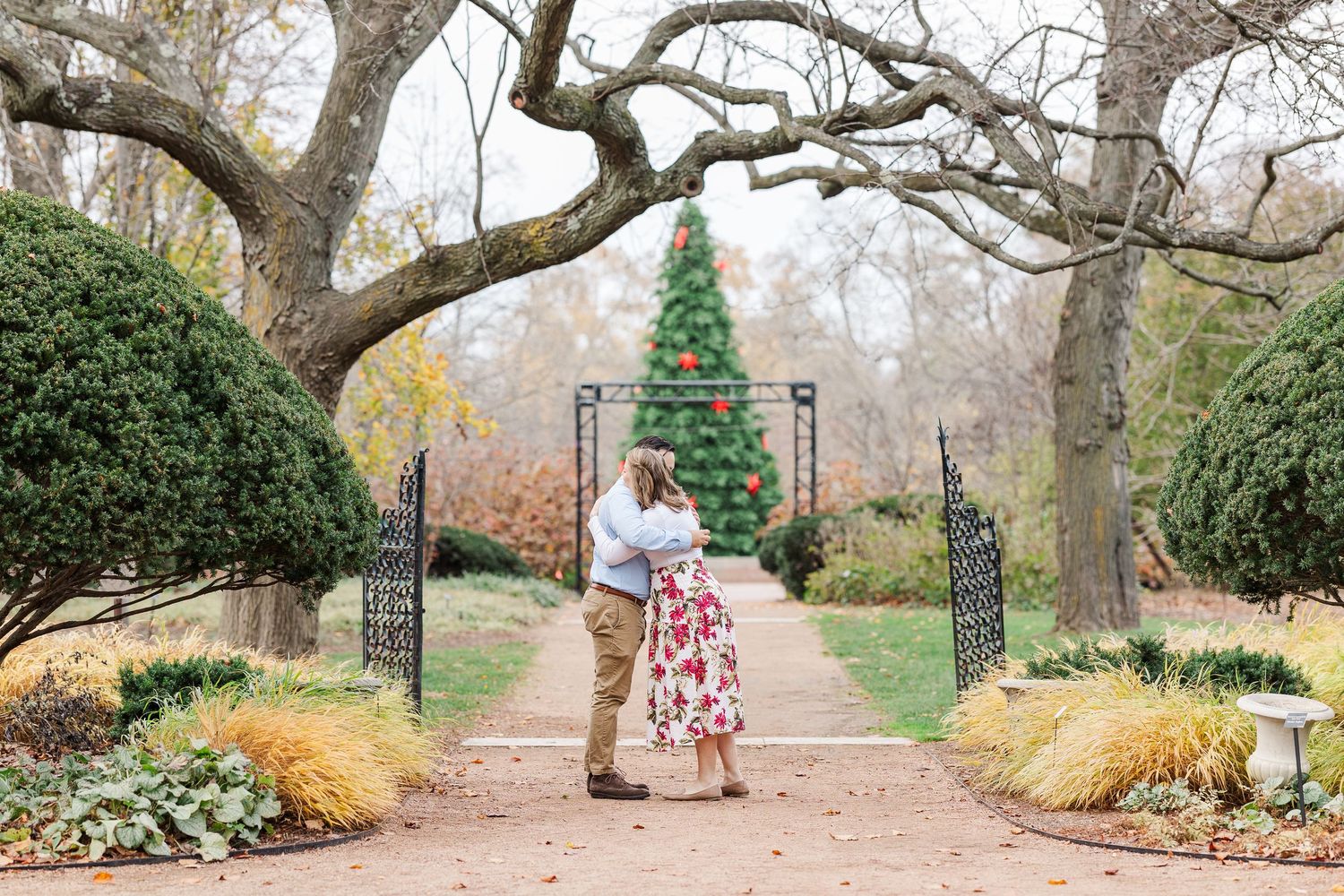 Man proposes to woman in the Keyhole Garden at Cantigny Park in Wheaton, IL