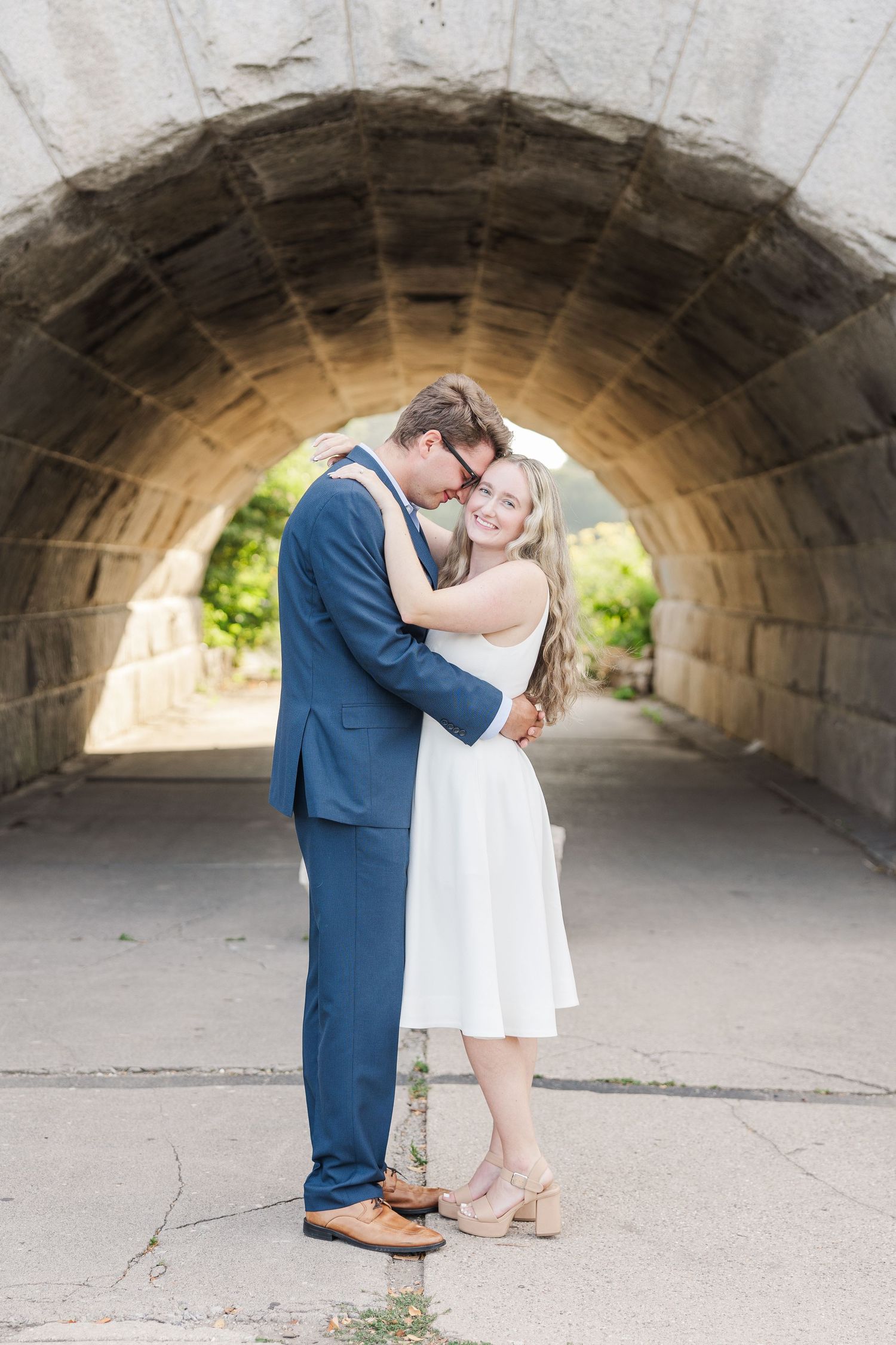 Elizabeth and Joe embracing under the Ulysses S. Grant Monument in Lincoln Park, Chicago