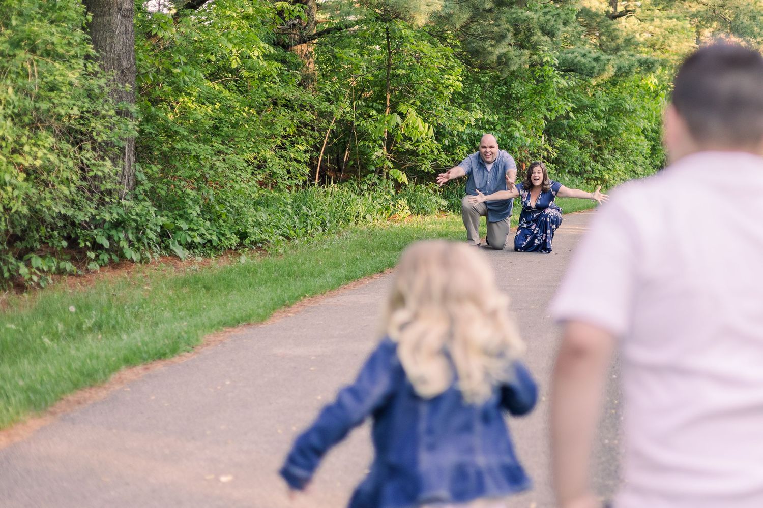 Blurred motion shot of family enjoying a walk on a nature trail.