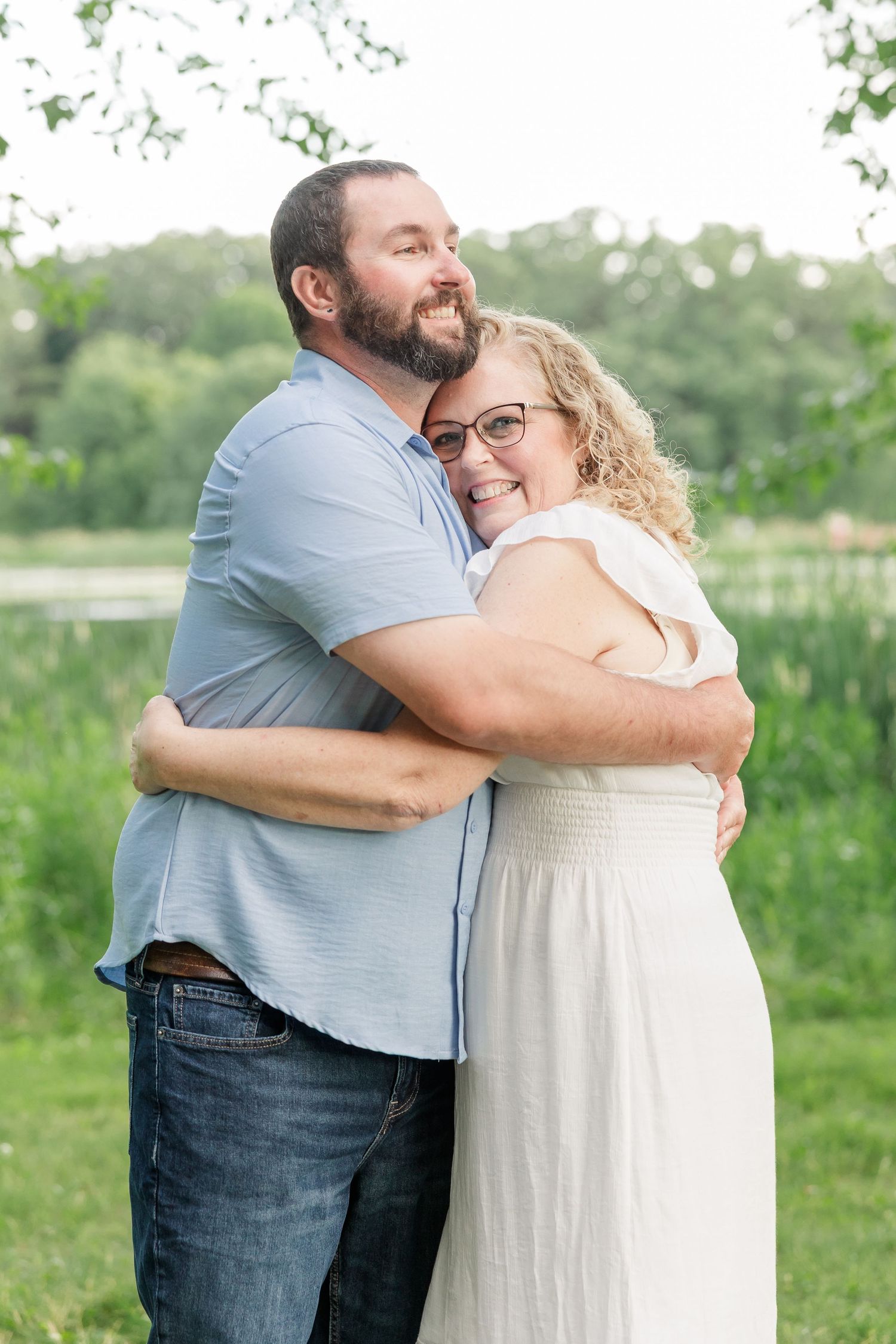 Mother and adult son hugging during an extended family photo session at Veterans Acres Nature Center