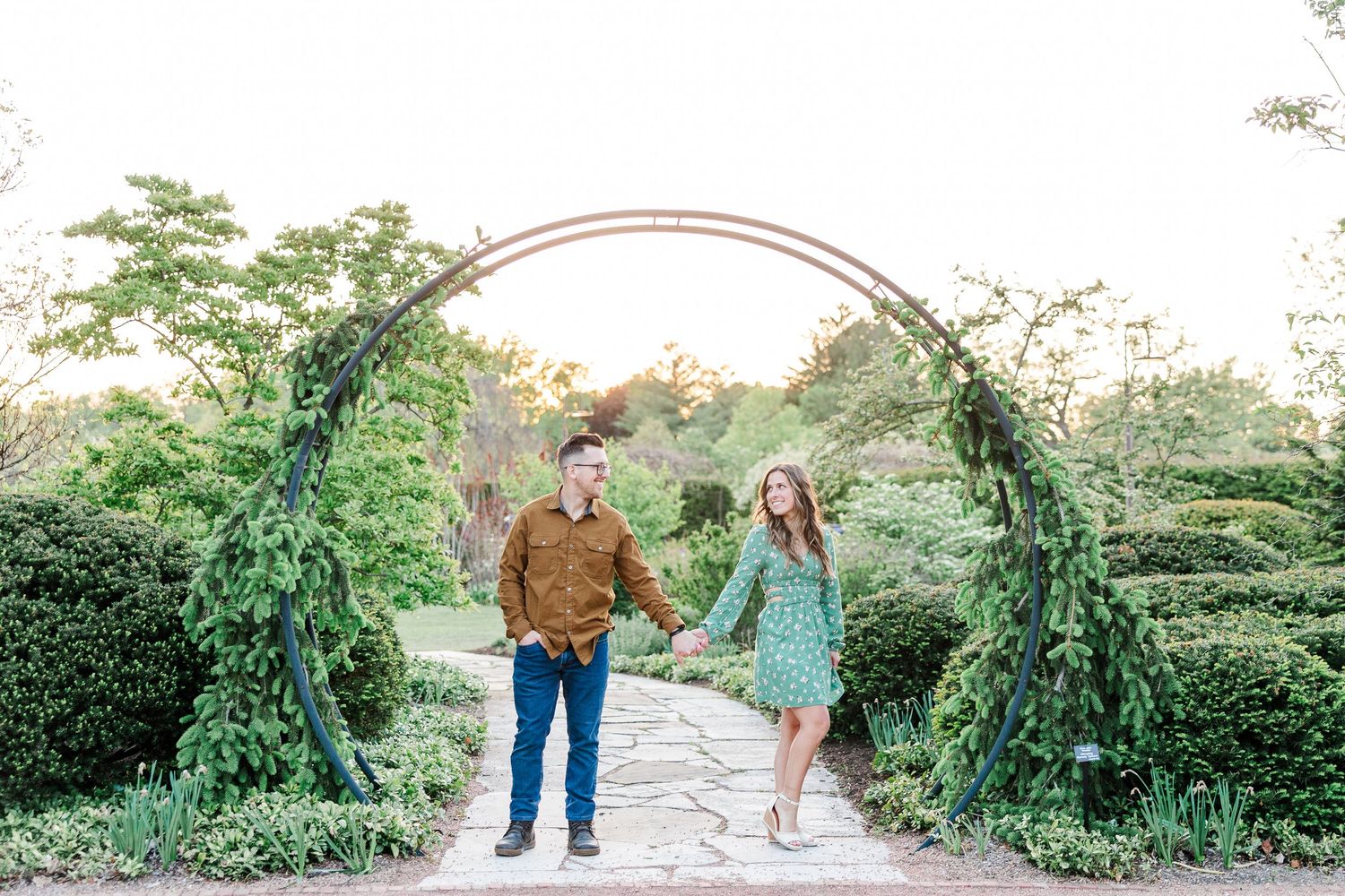 Engagement portrait under the garden arch at Cantigny Park in Wheaton Illinois